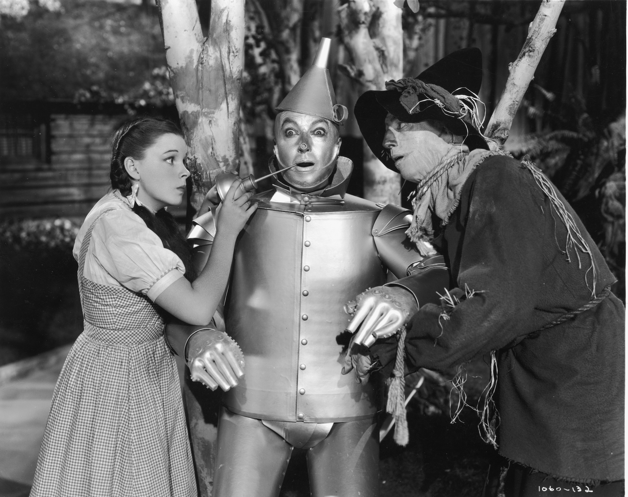 (L-R) Judy Garland as Dorothy, Jack Haley as the Tin Man, and Ray Bolger as Scarecrow