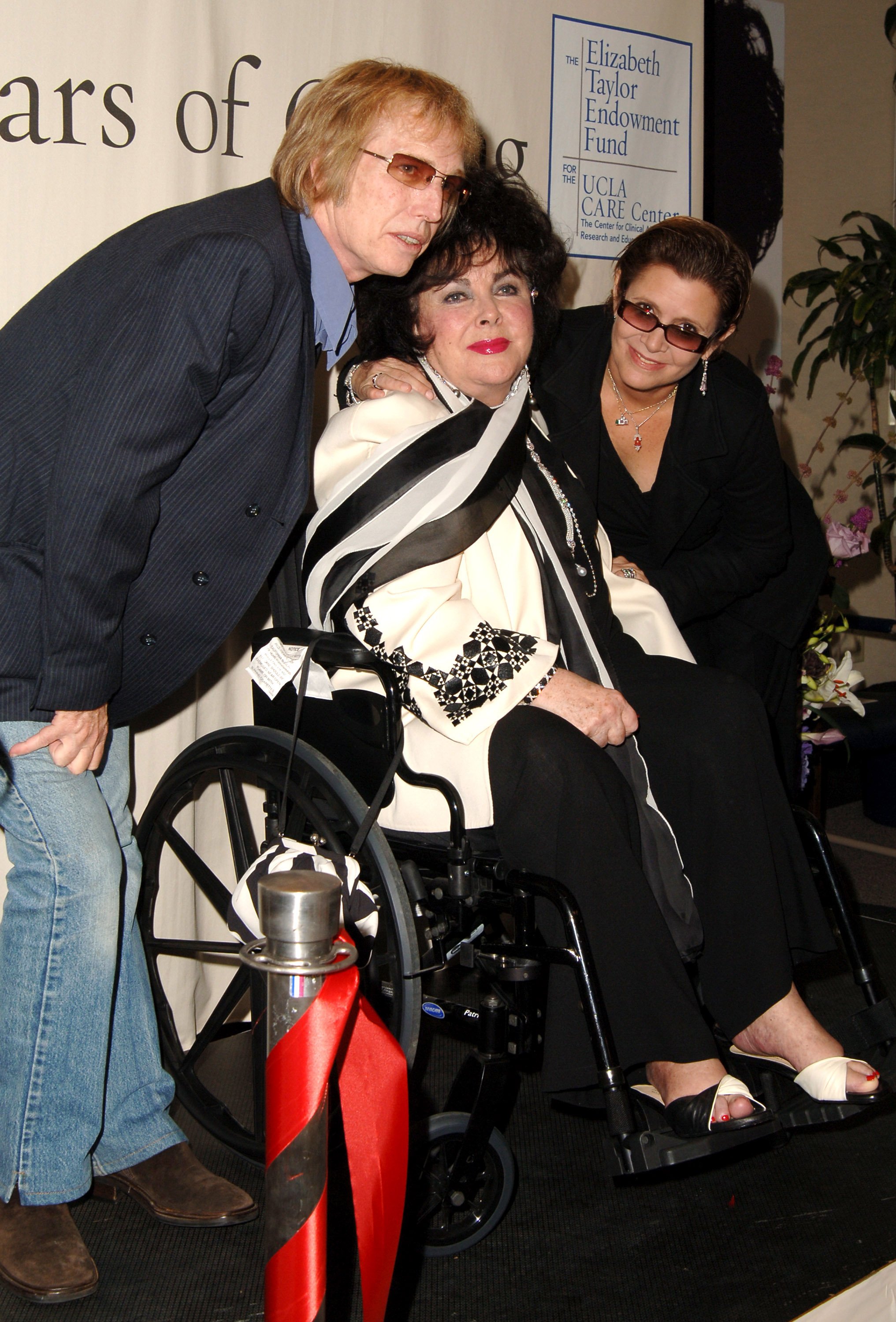 Tom Petty, Elizabeth Taylor and Carrie Fisher during UCLA Names Elizabeth Taylor Endowment Fund for Long Time AIDS Advocate Taylor and Friends Set to Cut Ribbon for New Center at UCLA Clinical Aids Research and Education CARE Center in Los Angeles, California, United States.