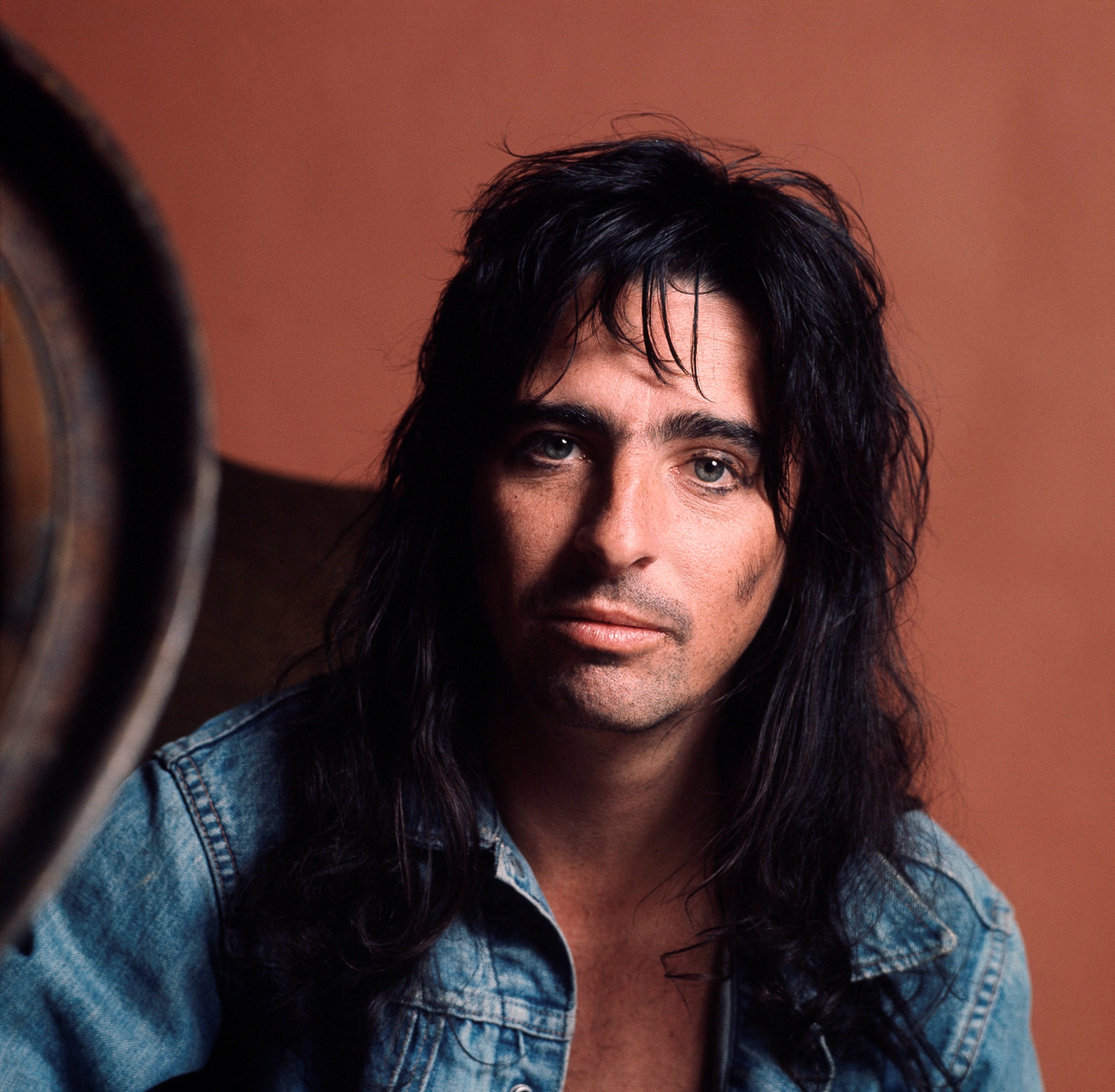 Alice Cooper with a red background