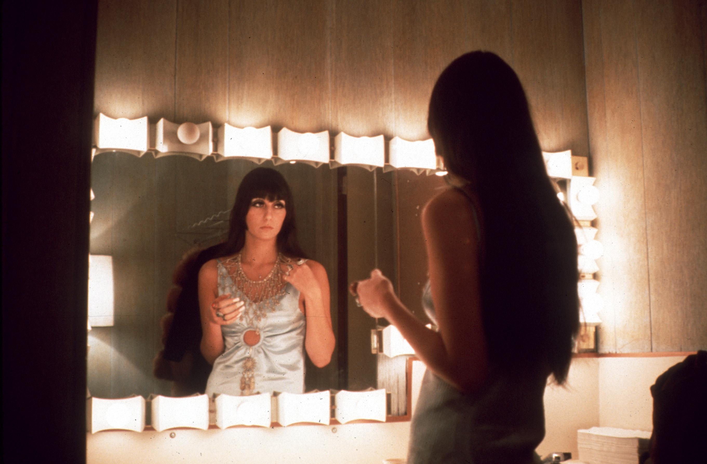 Cher at a mirror
