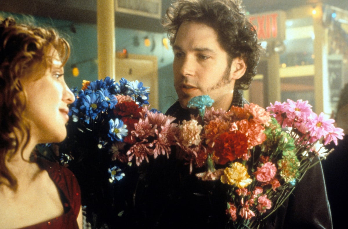 Courtney Love with Paul Rudd, holding flowers