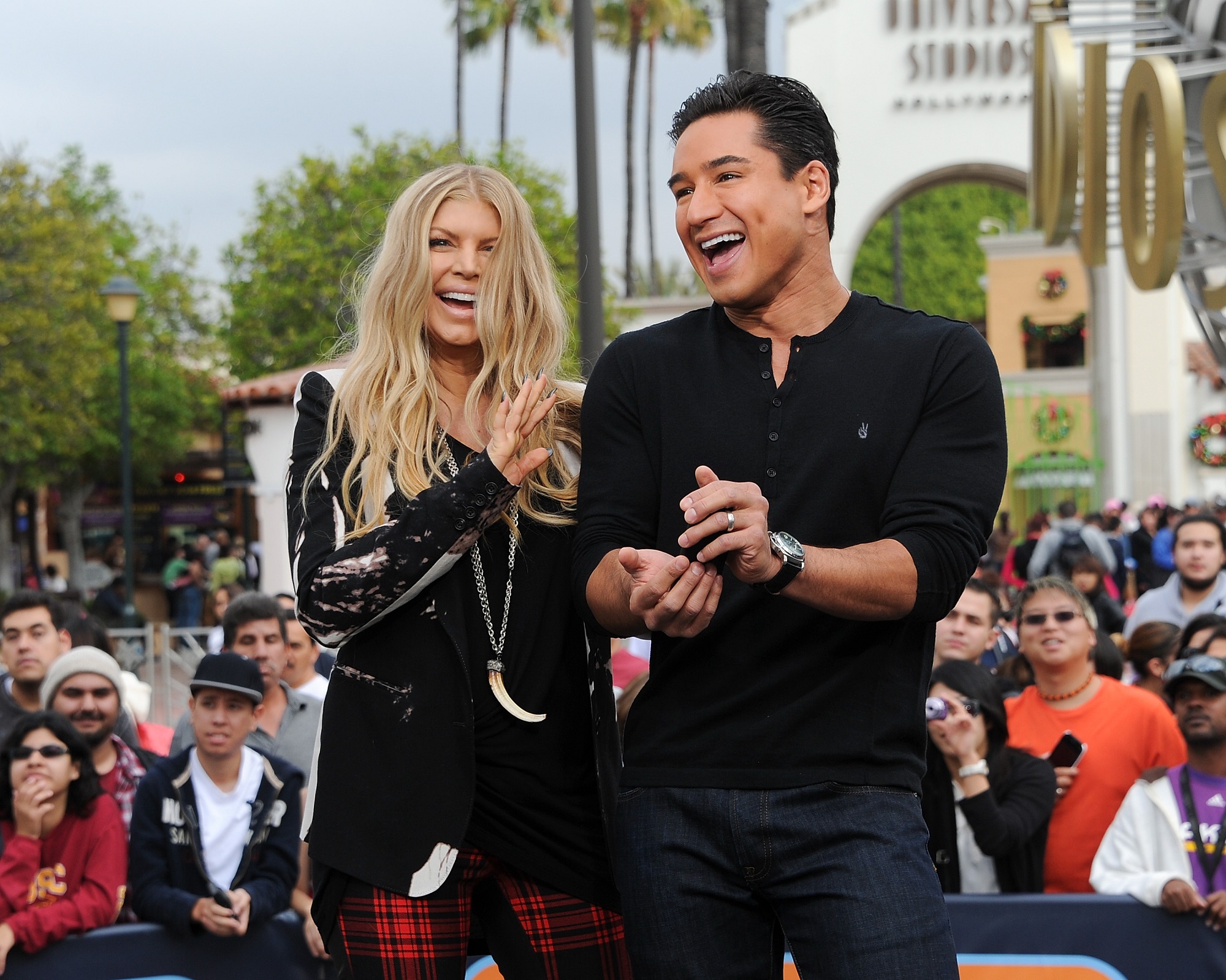 Fergie (L) and Mario Lopez visit 'Extra' at Universal Studios Hollywood on November 20, 2013, in Los Angeles, California.