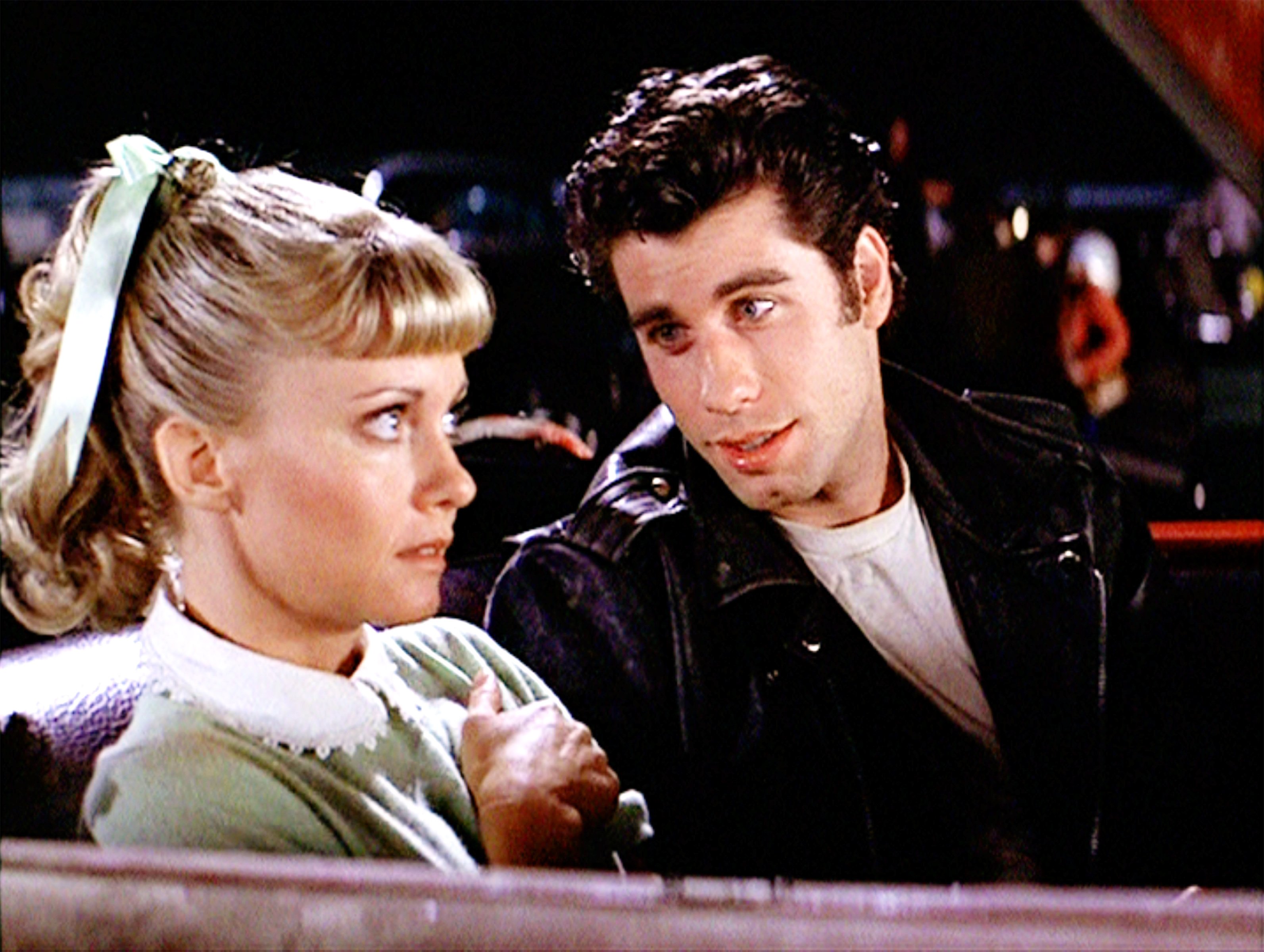 Olivia Newton-Jon and John Travolta in a car in Grease