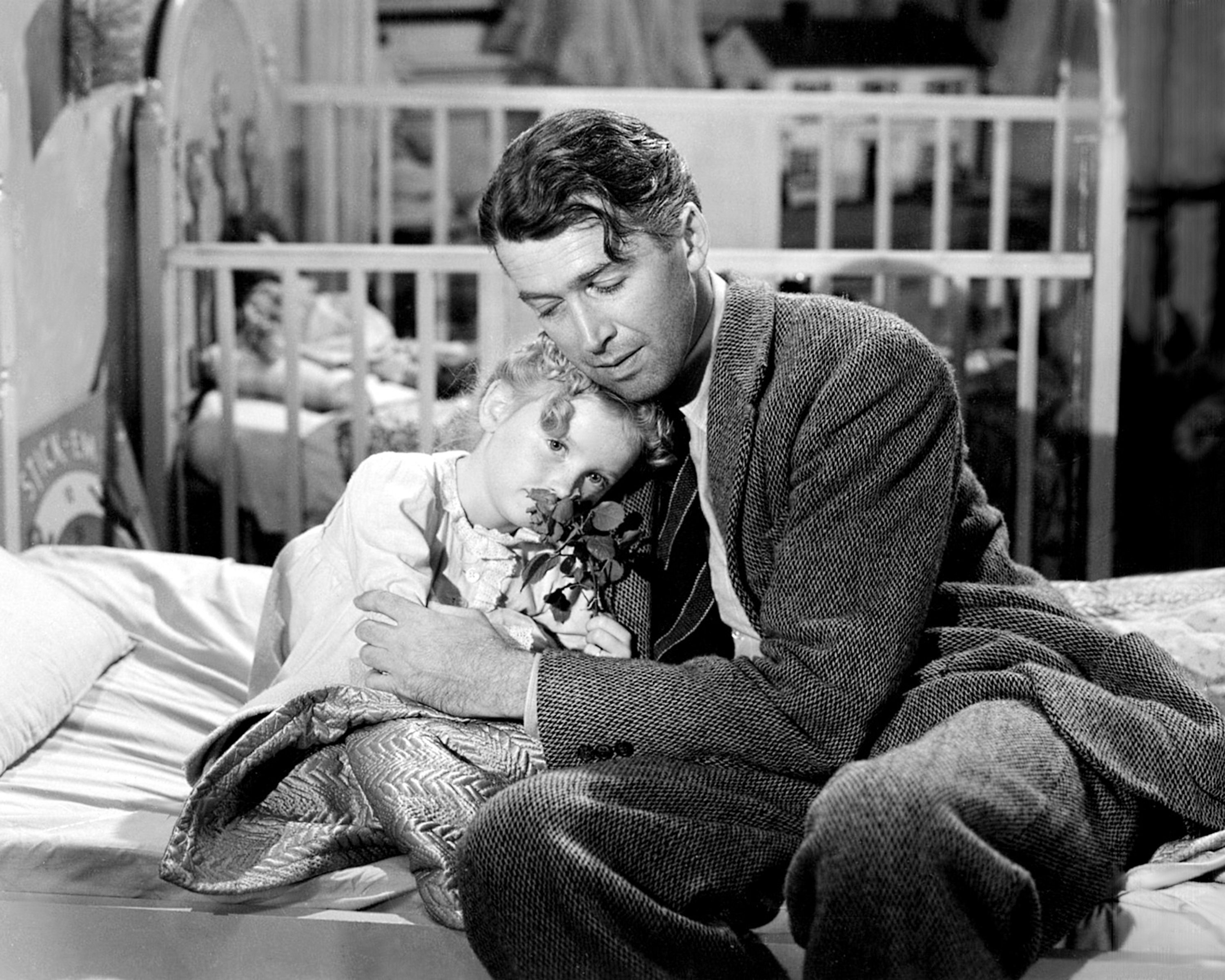 James Stewart and on a bed in It's a Wonderful Life