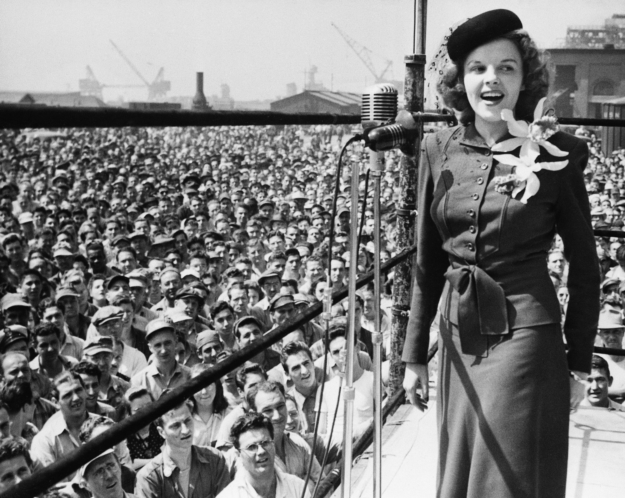 Judy Garland entertains civilian employees at the Philadelphia Navy Yard during a War Bond Drive in 1944.
