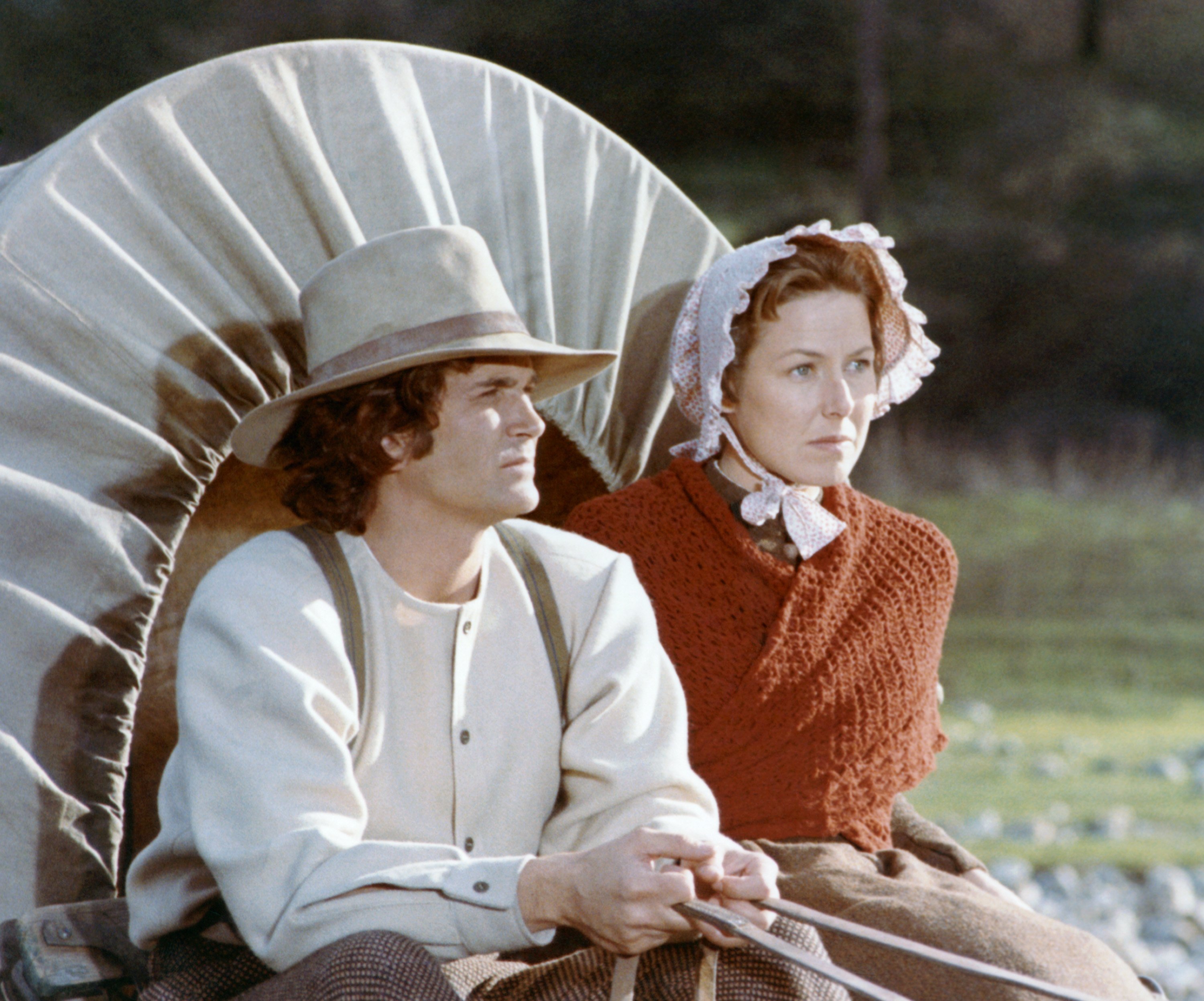 Michael Landon and Karen Grassle in a covered wagon