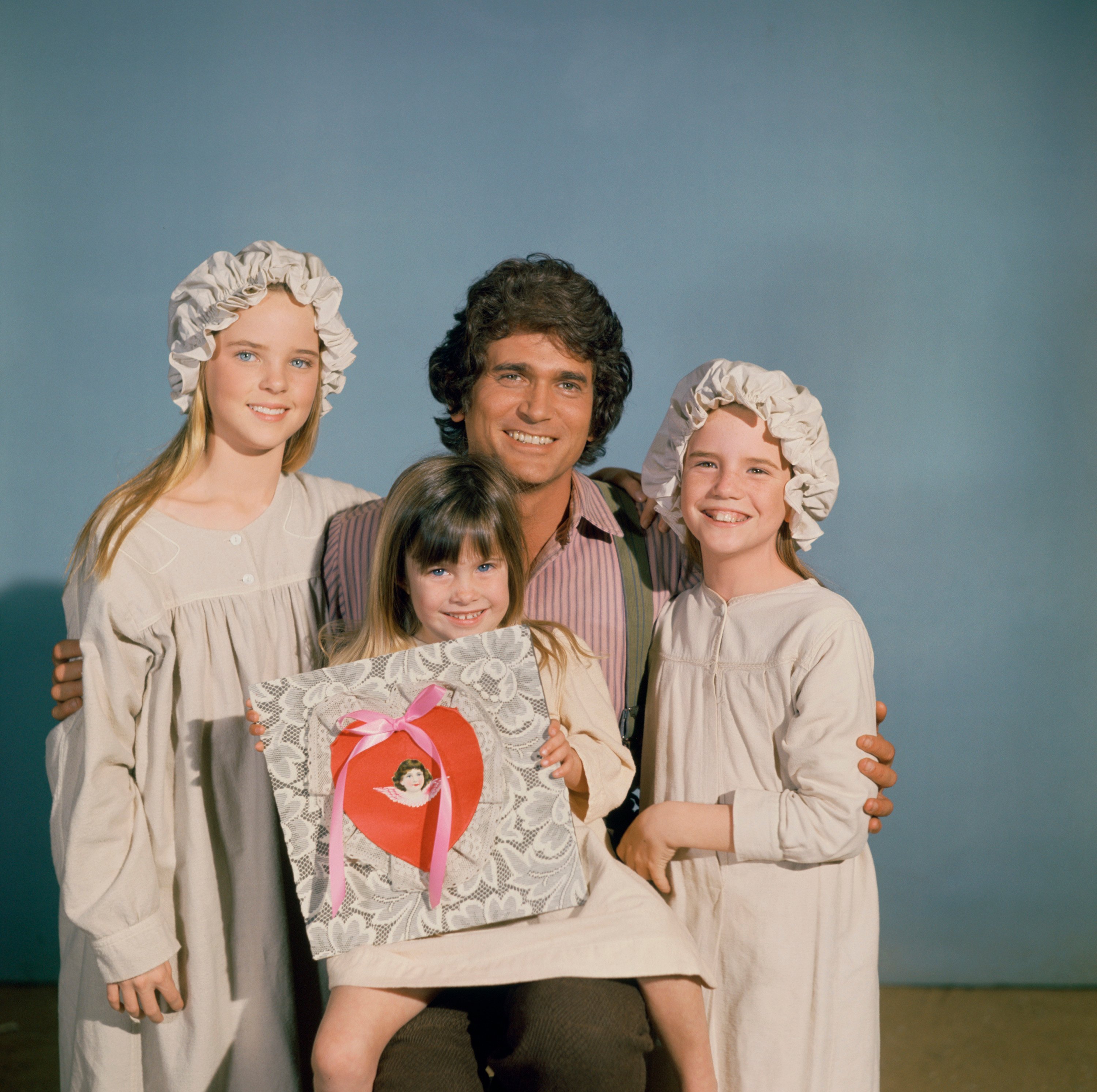 Lindsay or Sydney Greenbush, Michael Landon, and Melissa Gilbert  with a bag