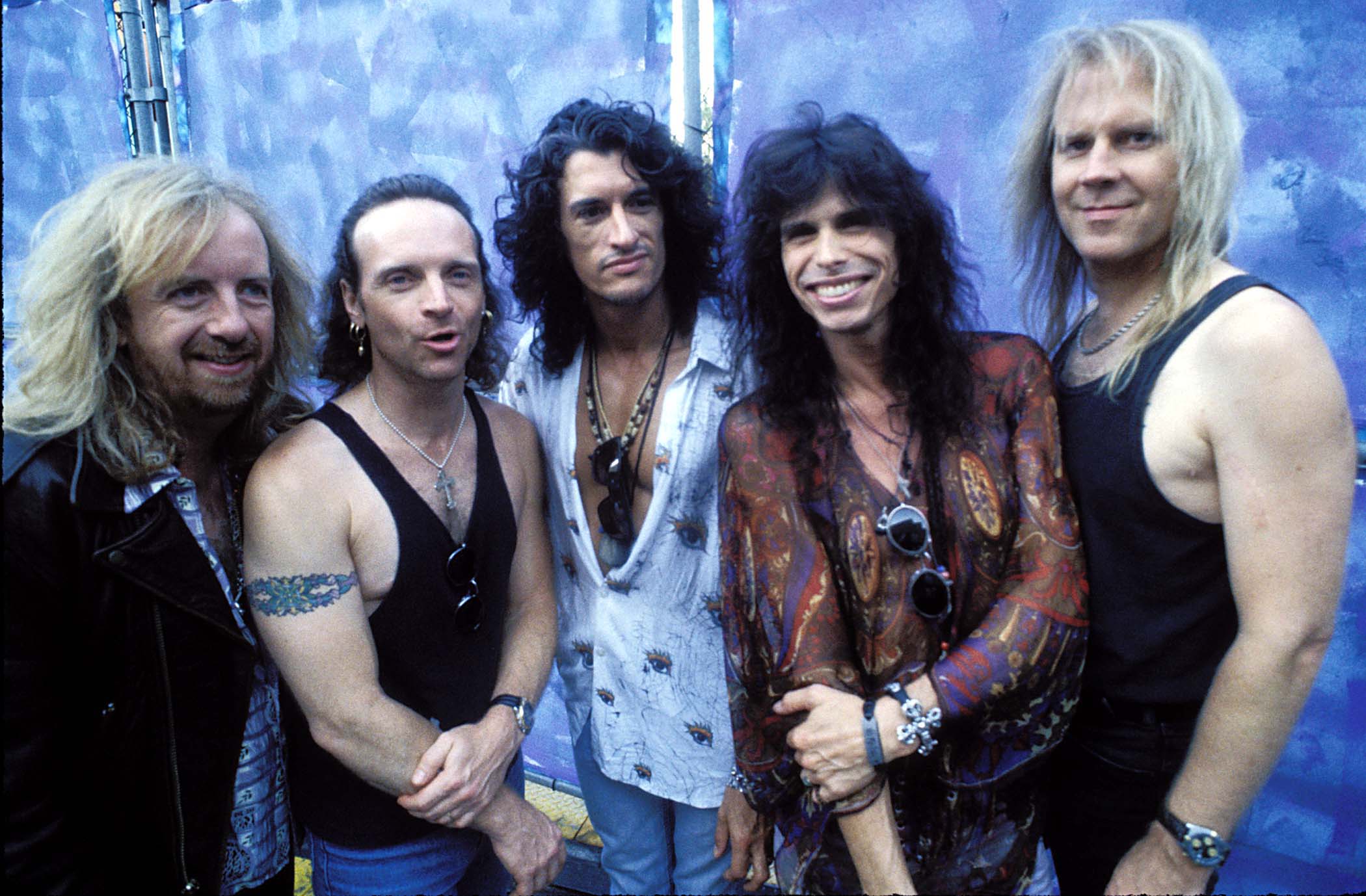 Aerosmith in front of a wall