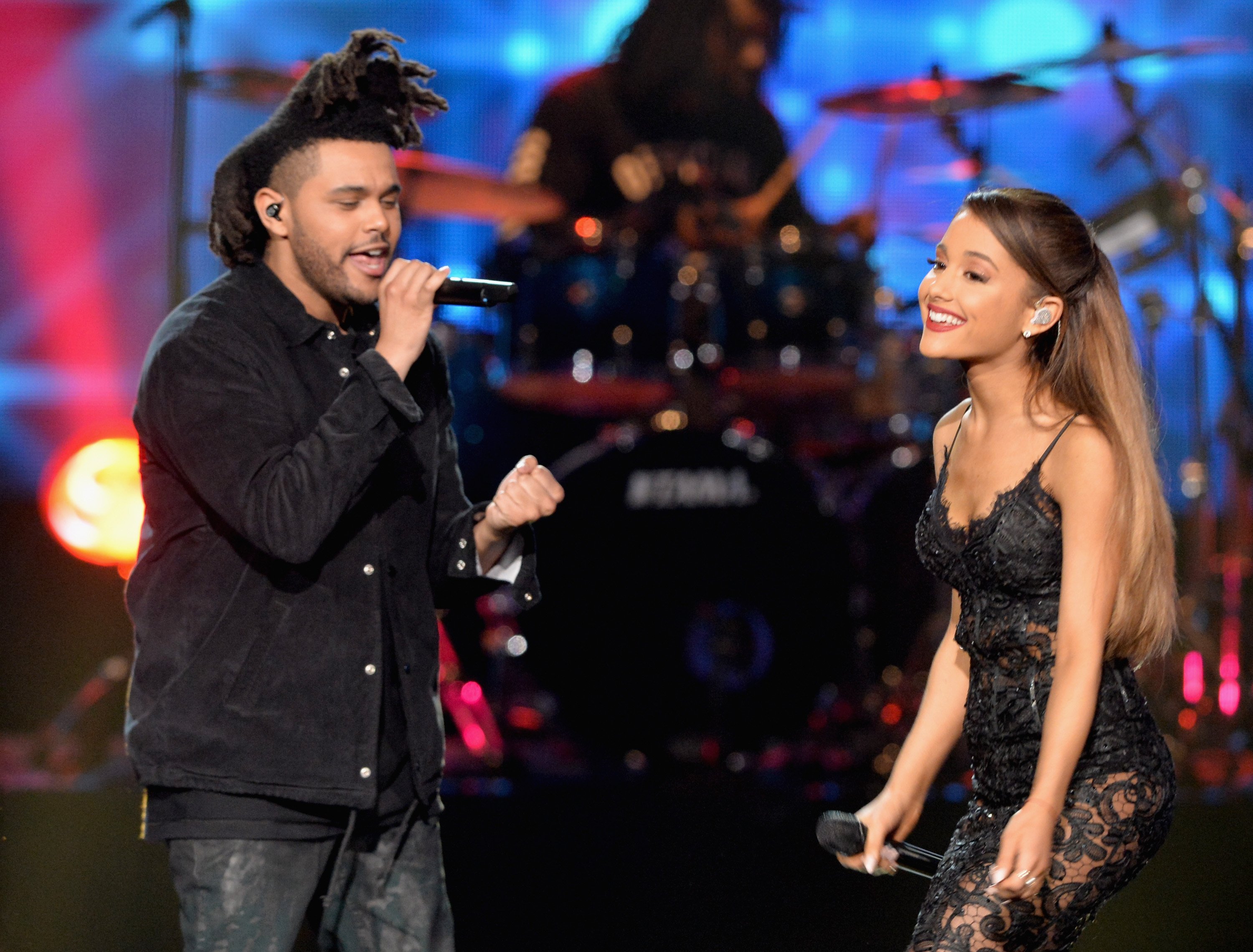The Weeknd (L) and Ariana Grande perform onstage at the 2014 American Music Awards on November 23, 2014 in Los Angeles, California.