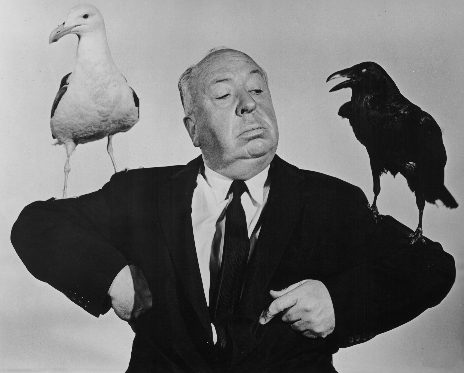 Alfred Hitchcock poses for a promotional still for 'The Birds' in 1963
