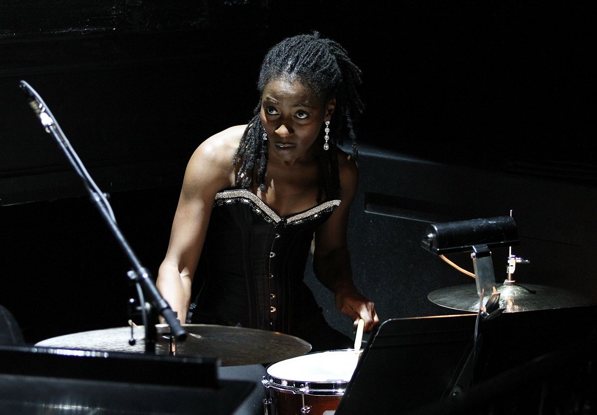 Ameenah Kaplan playing the drums in 2011