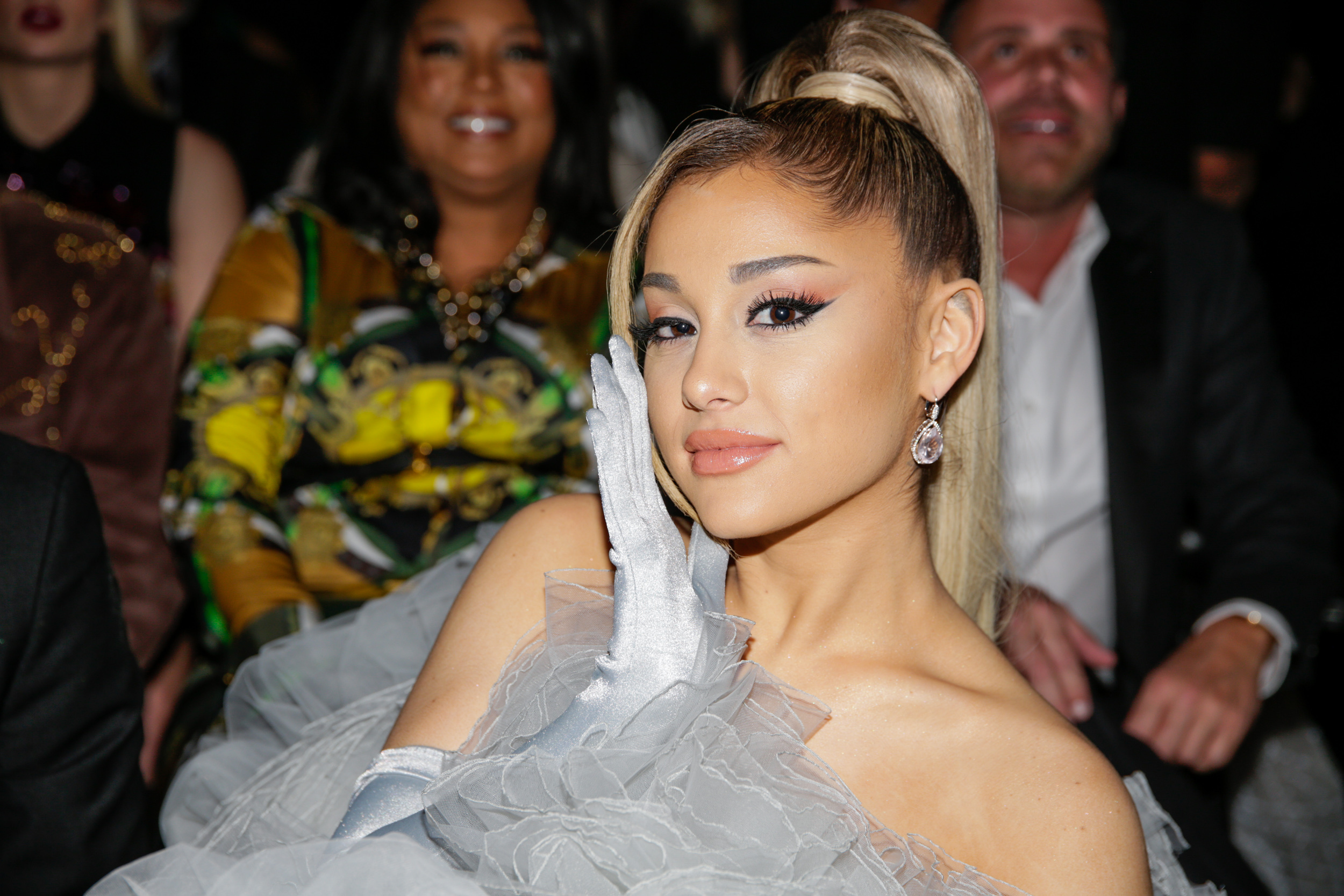 Ariana Grande smiles for a photo on the red carpet