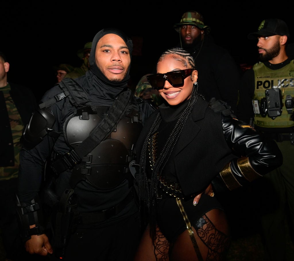 Nelly and Ashanti pose together at a Halloween party