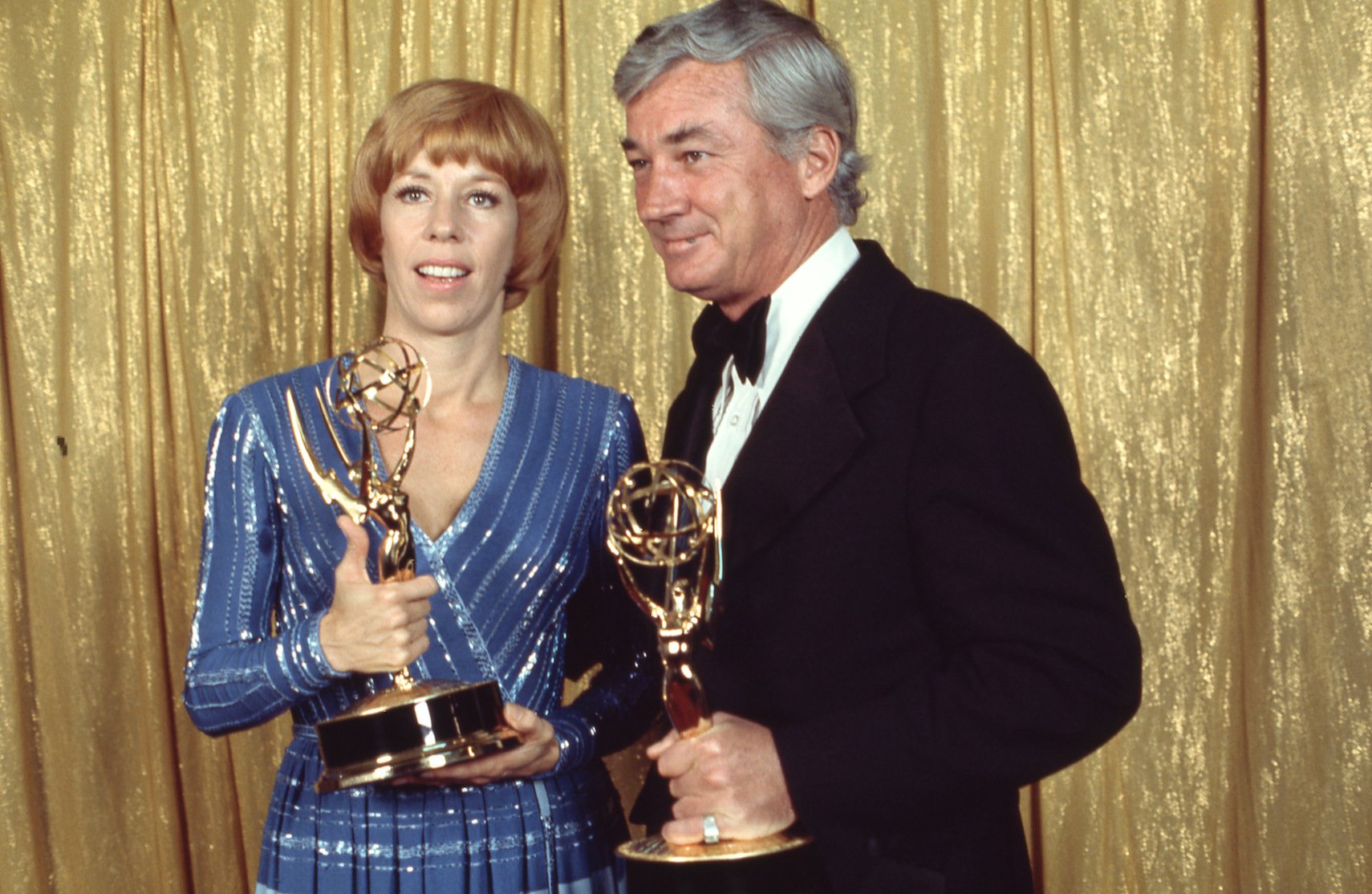 Carol Burnett and Joe Hamilton holding their Emmy Awards