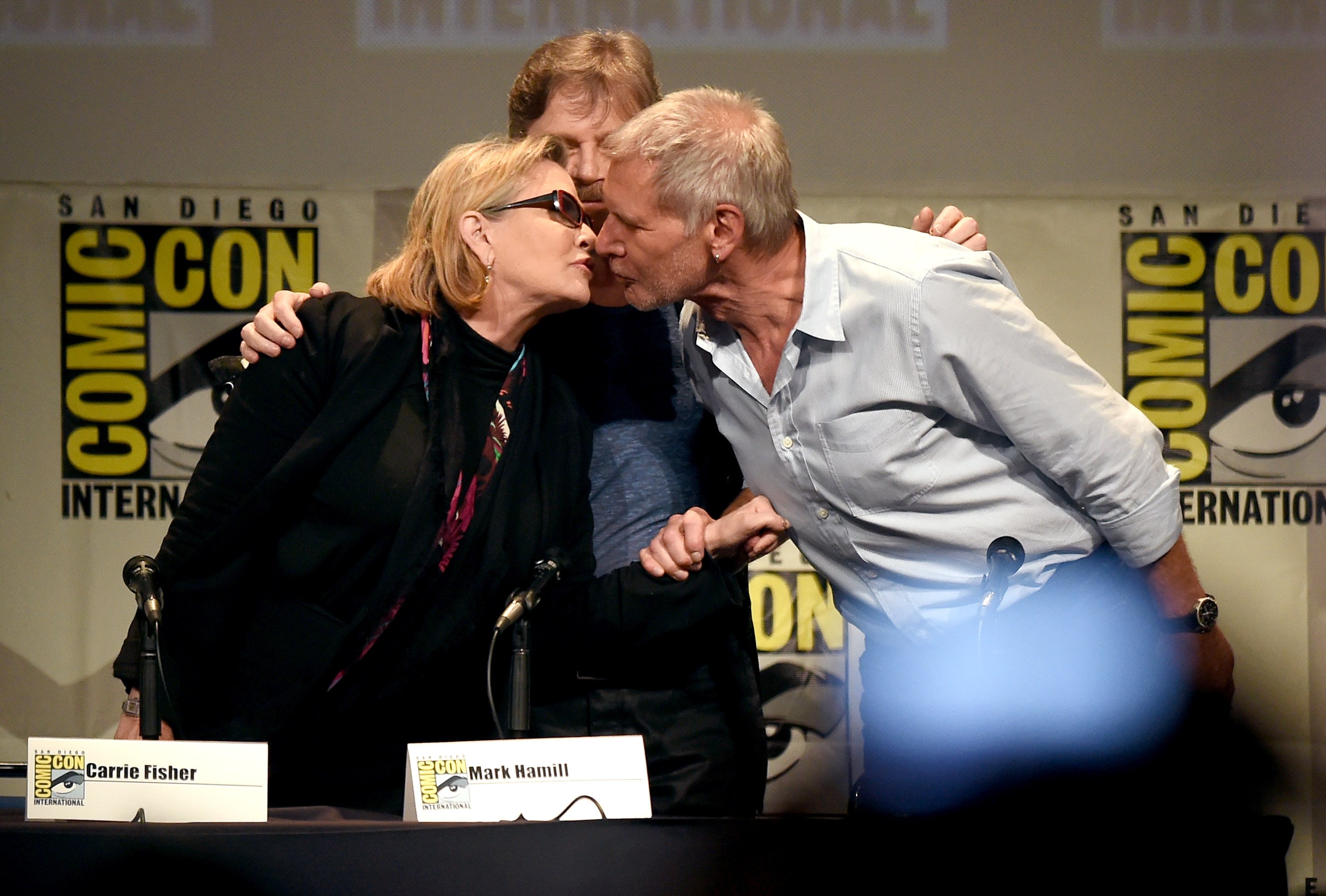 ) Actors Carrie Fisher, Mark Hamill and Harrison Ford pose onstage at the Lucasfilm panel during Comic-Con International 2015 at the San Diego Convention Center on July 10, 2015 in San Diego, California.