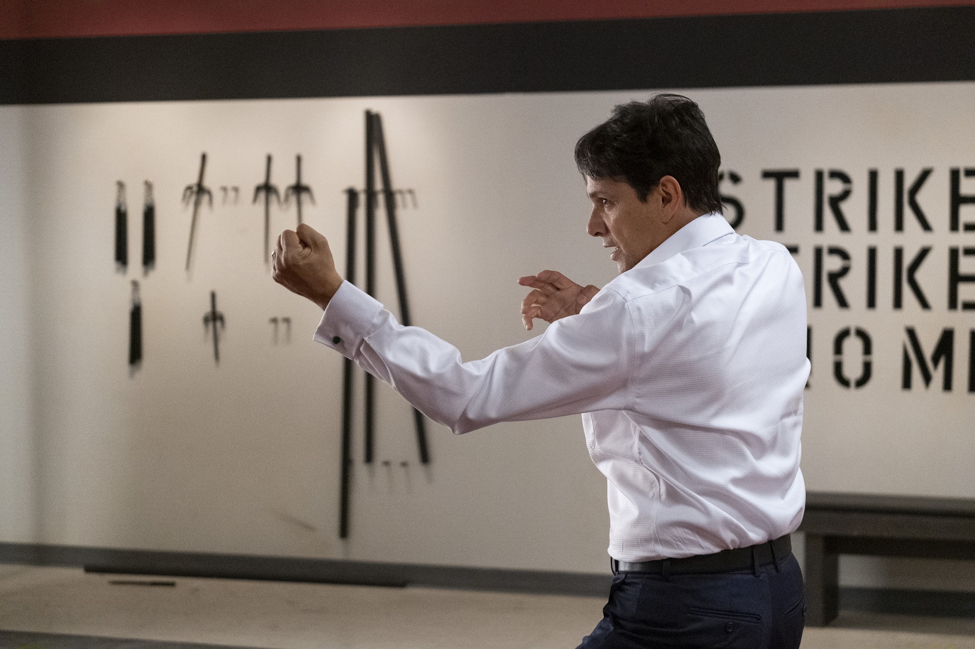 Ralph Macchio takes Karate stance in the Cobra Kai dojjo