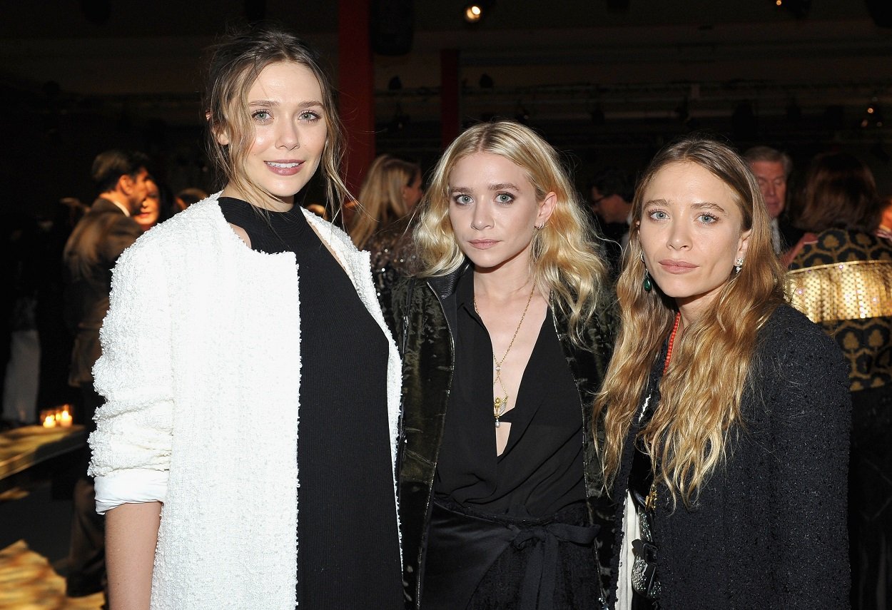 sisters Elizabeth Olsen, Ashley Olsen, and Mary-Kate Olsen