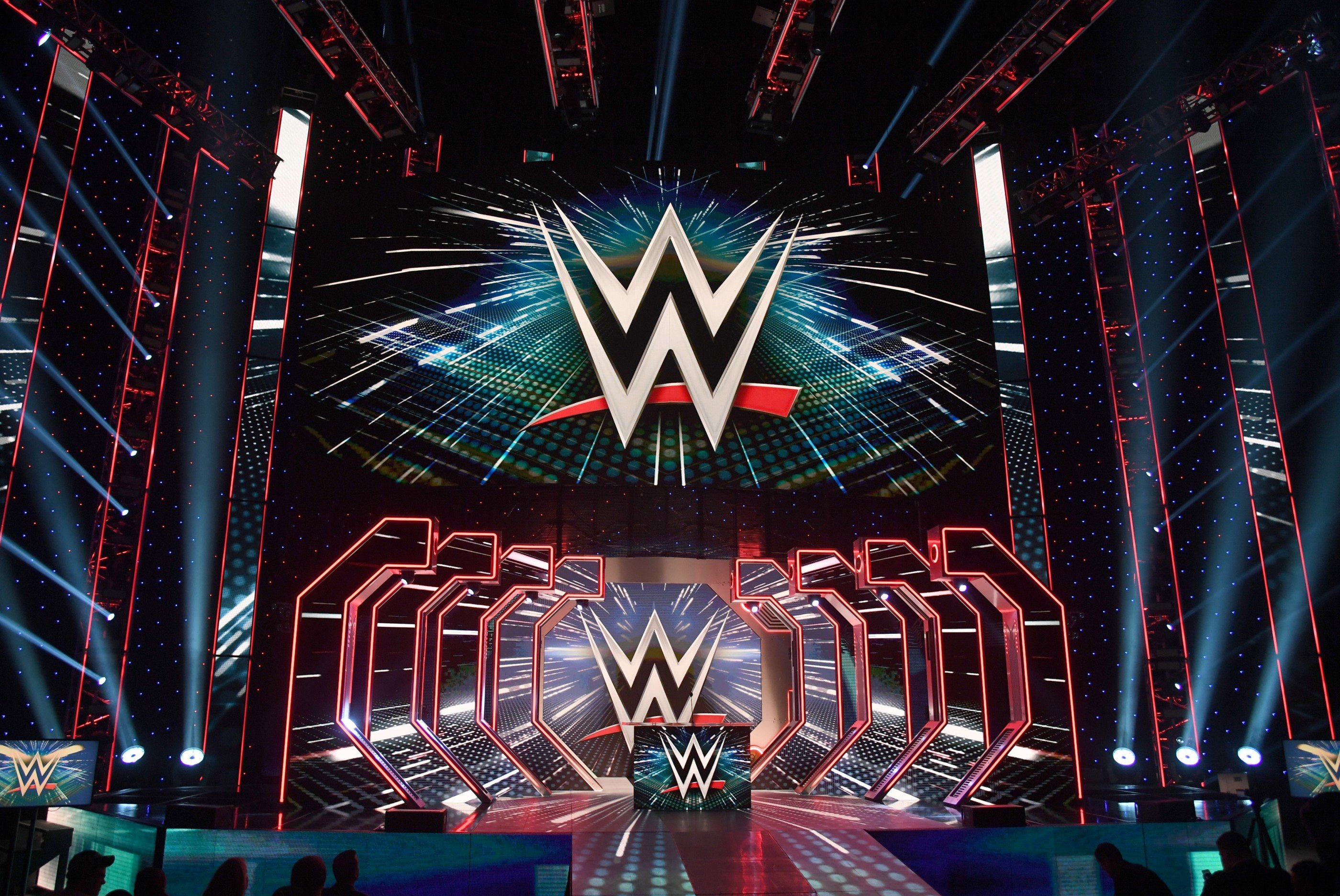 WWE logos are shown on screens before a WWE news conference at T-Mobile Arena on October 11, 2019 in Las Vegas, Nevada.