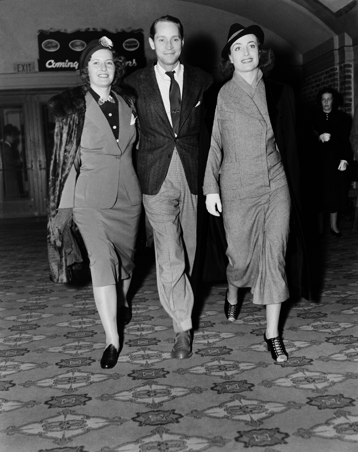 (L to R): Barbara Stanwyck, Crawford's then-husband Franchot Tone, and Joan Crawford, 1938