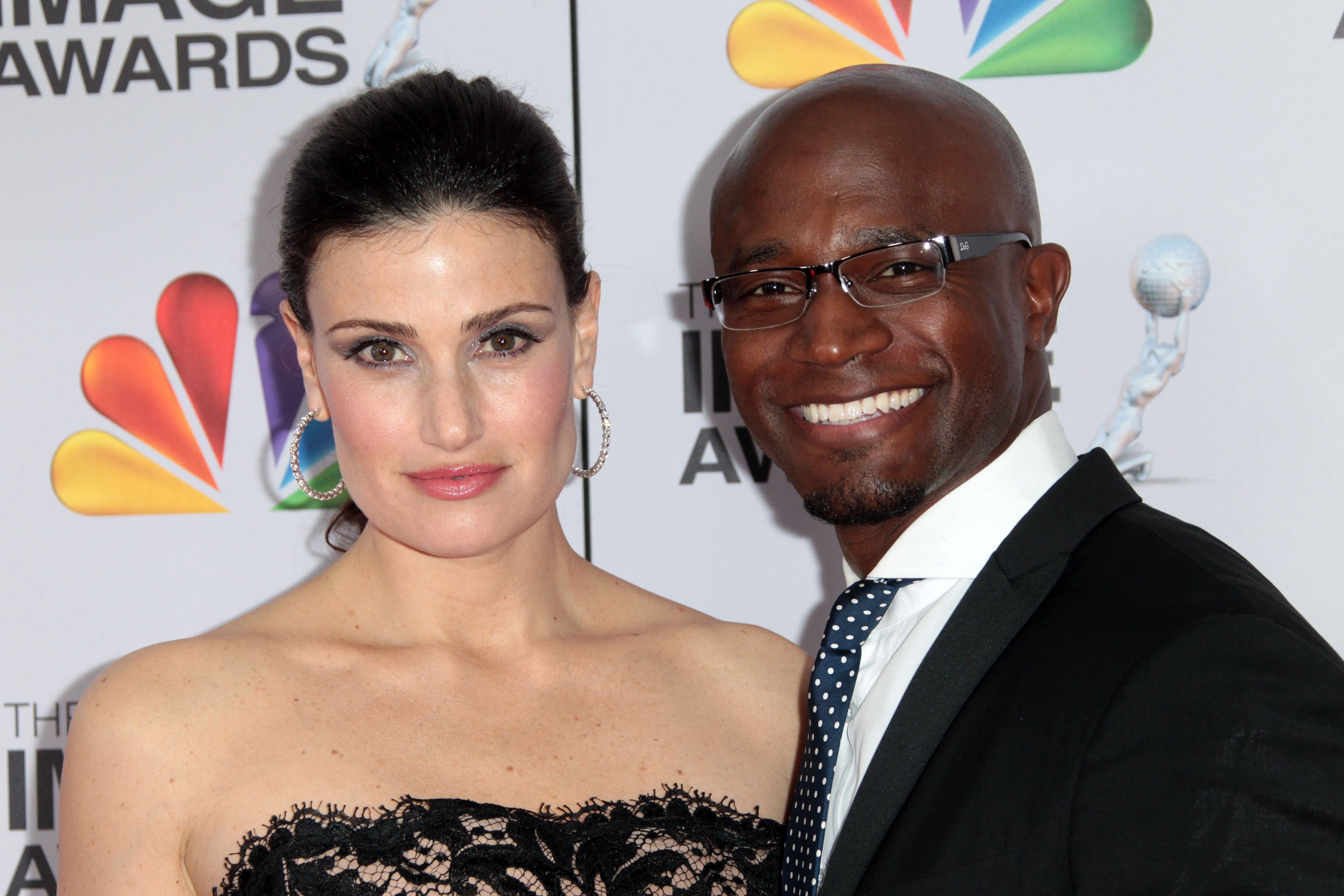 Actress Idina Menzel (L) and actor Taye Diggs arrive at the 43rd NAACP Image Awards held at The Shrine Auditorium on February 17, 2012 in Los Angeles, California.