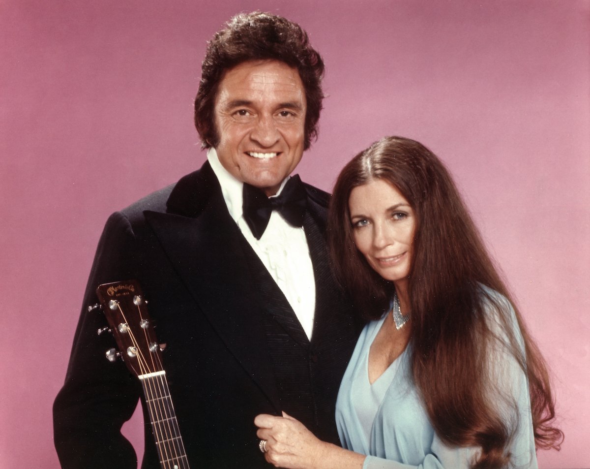 Johnny Cash and June Carter Cash pose for a portrait in circa 1975.