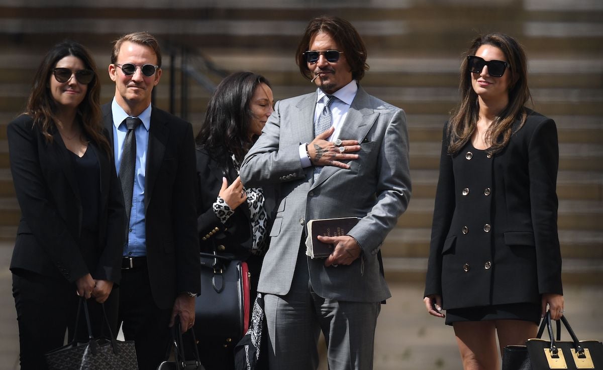 Johnny Depp leaves with members of his team including  lawyer Adam Waldman
