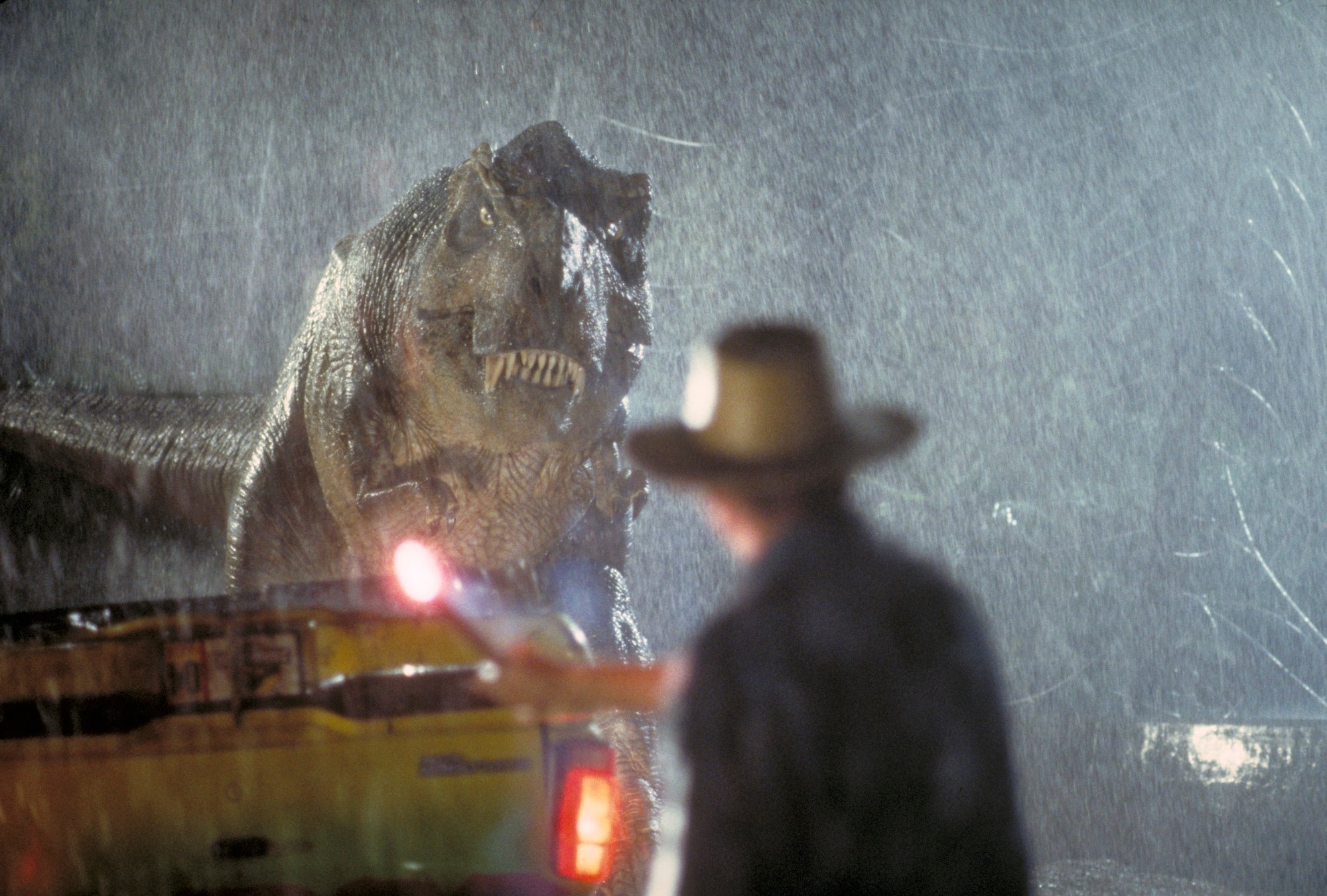 Actor Sam Neill as Dr. Alan Grant takes on a Tyrannosaurus Rex in a scene from the film 'Jurassic Park'