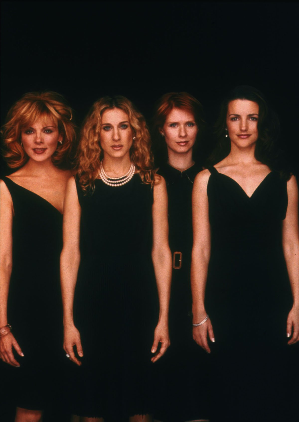 Kim Cattrall, Sarah Jessica Parker, Cynthia Nixon, and Kristin Davis pose for a portrait in an undated photo on the set of the HBO series 'Sex and the City'
