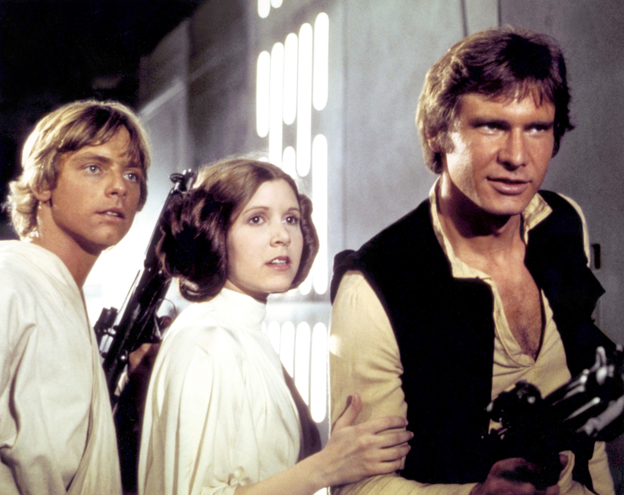 Mark Hamill, Carrie Fisher, and Harrison Ford on the set of 'Star Wars: Episode IV - A New Hope'