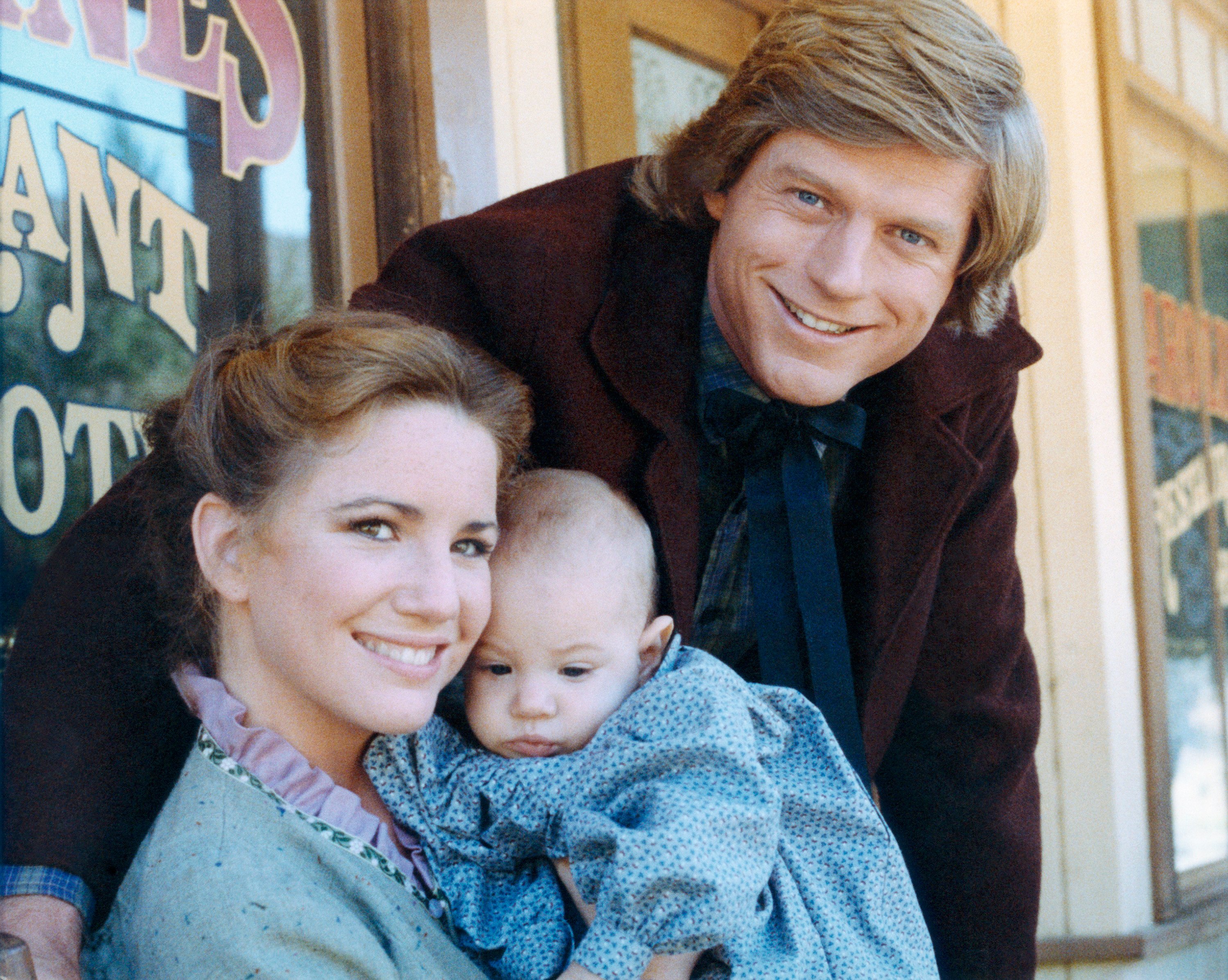 LITTLE HOUSE ON THE PRAIRIE -- Season 8 -- Pictured: (l-r) Melissa Gilbert as Laura Elizabeth Ingalls Wilder, Michelle Steffin as Rose Wilder, Dean Butler as Almanzo James Wilder 