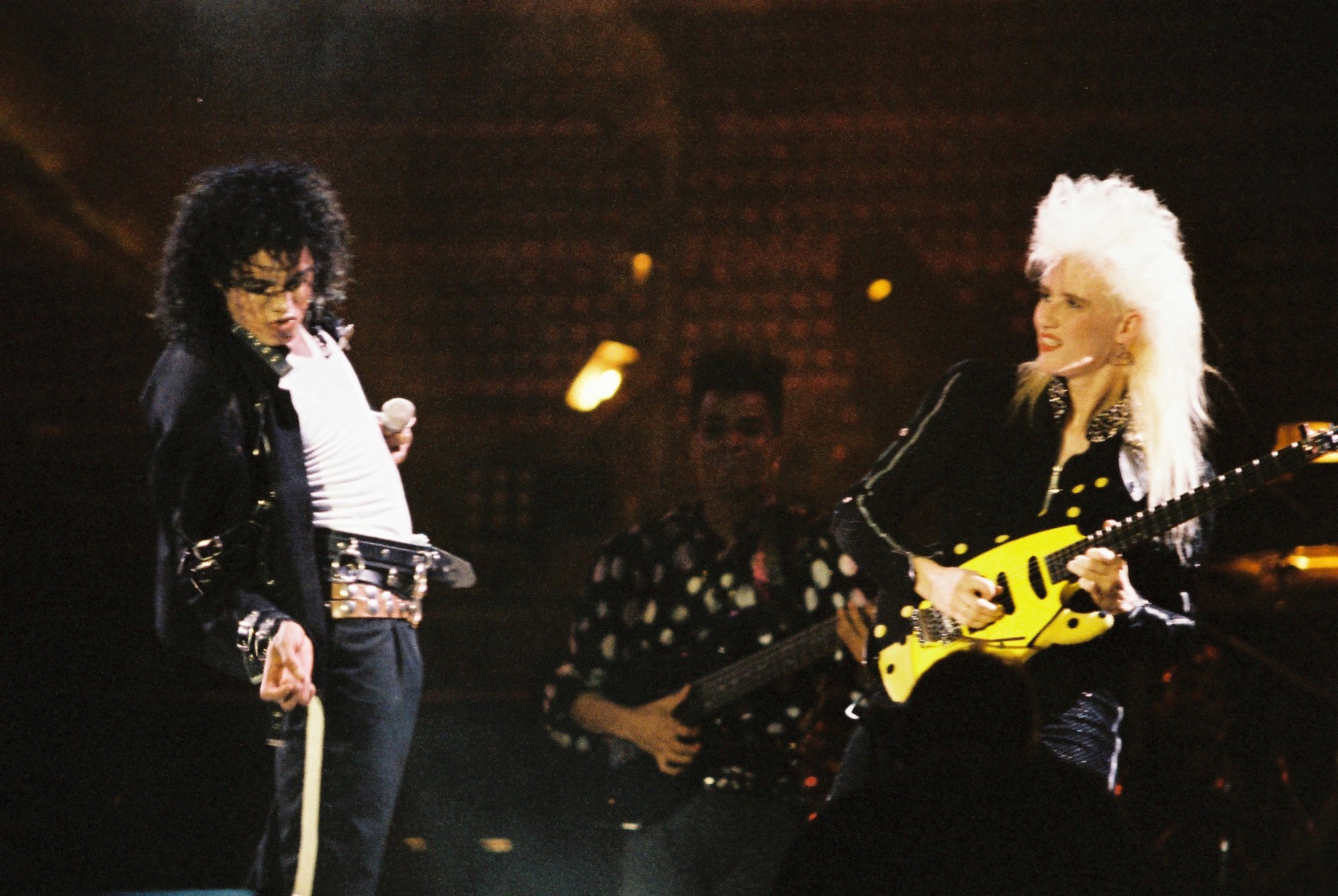 (L-R) Michael Jackson and Jennifer Batten perform on stage