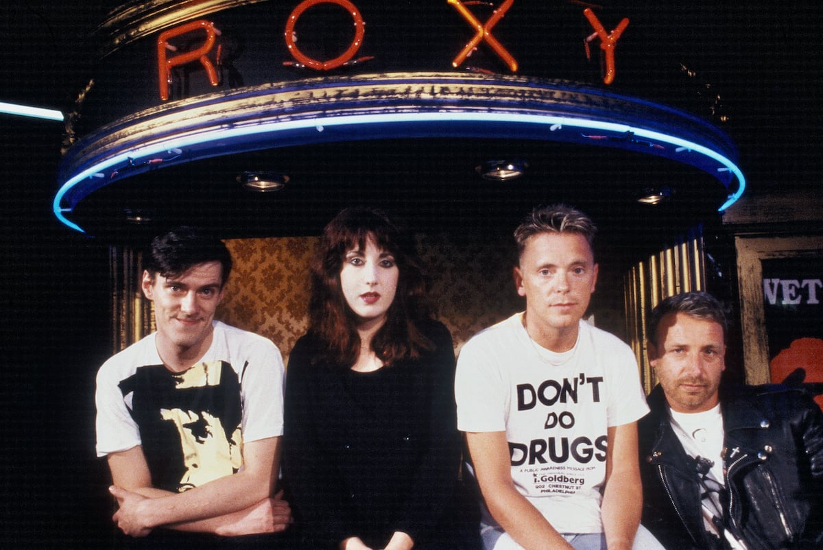 Stephen Morris, Gillian Gilbert, Bernard Sumner, and Peter Hook, of the band New Order