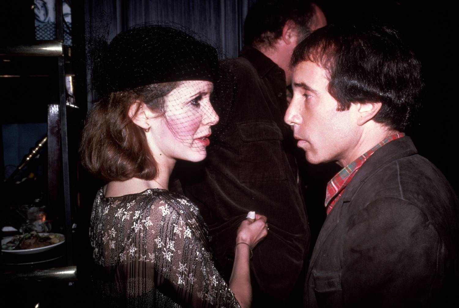 NEW YORK - CIRCA 1980: Carrie Fisher and Paul Simon circa 1980 in New York City.