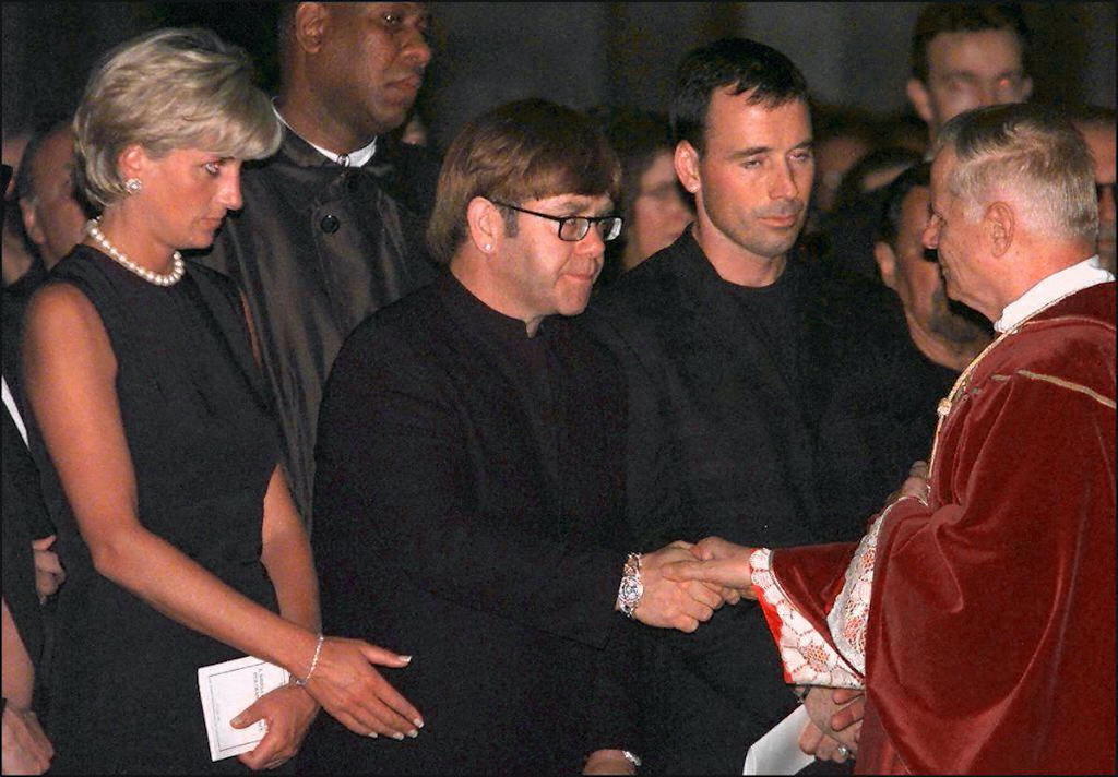 Princess Diana and Sir Elton John (center) at the requiem mass for Gianni Versace in 1997
