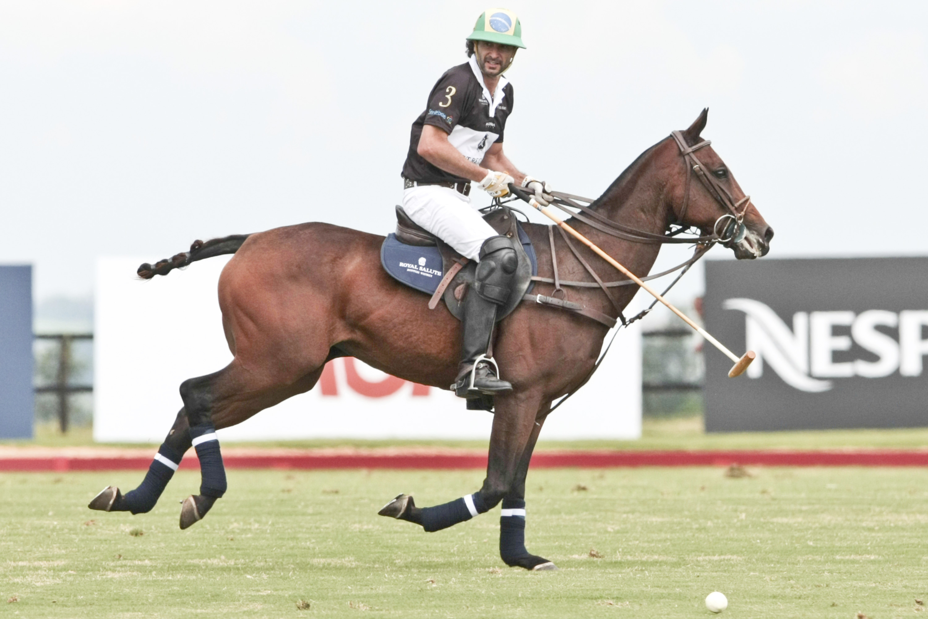 Rico Mansur rides his horse during a match as part of the Sentebale Royal Salute Polo Cup 2012