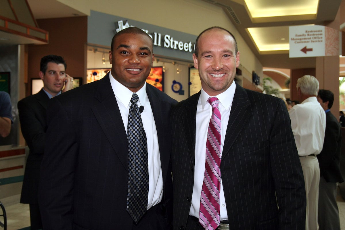 Former Miami Dolphin Shawn Wooden poses for pictures with season 2 apprentice cast member Bradford Cohen during season five casting call for "The Apprentice" 