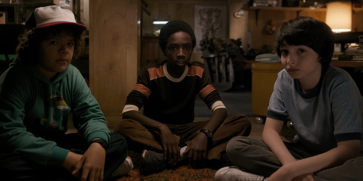 Finn Wolfhard as Mike, Gaten Matarazzo as Dustin, and Caleb McLaughlin as Lucas on 'Stranger Things'