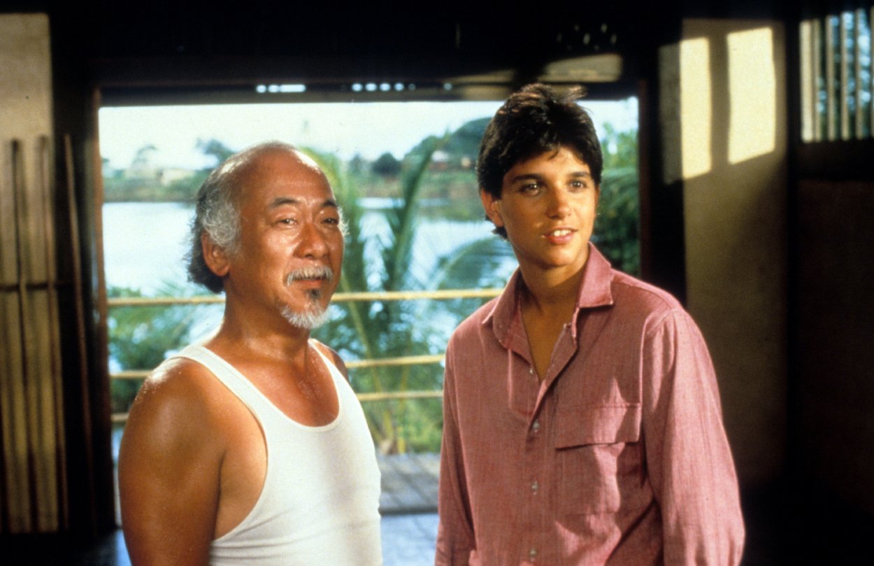 Pat Morita and Ralph Macchio in a scene from 'The Karate Kid'