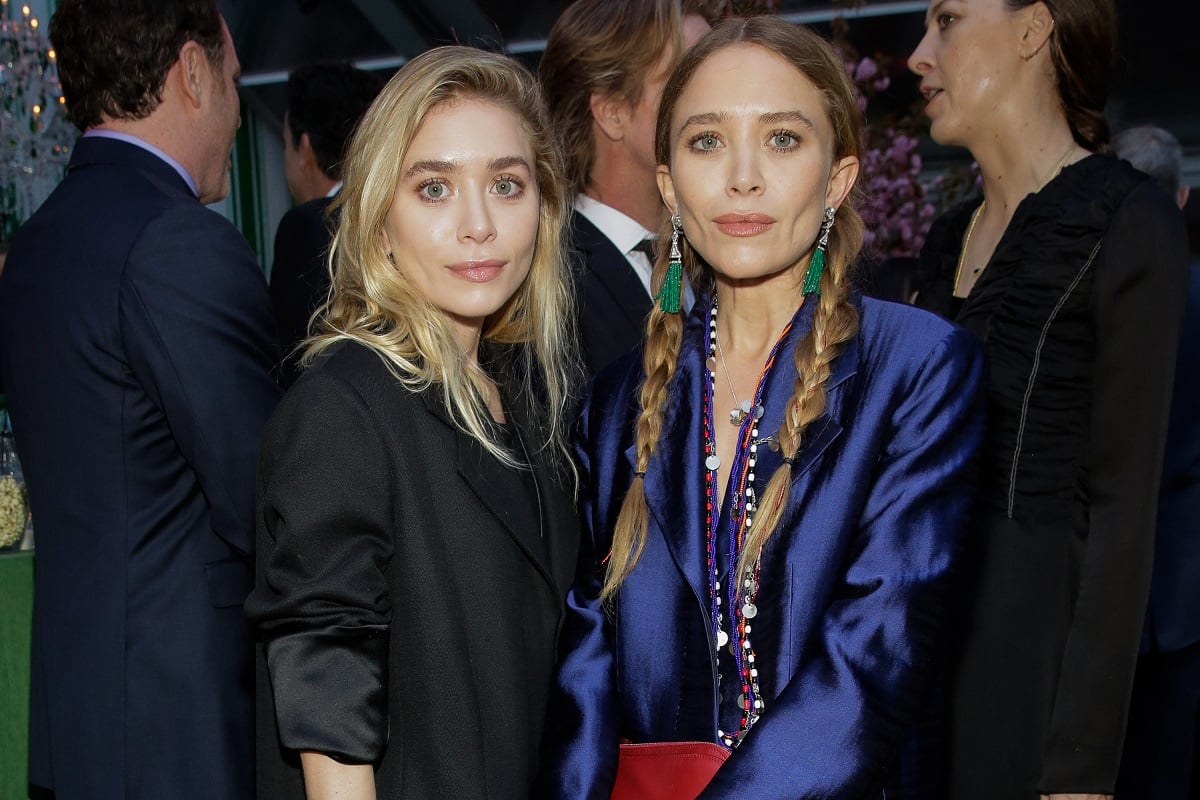 Ashley Olsen and Mary-Kate Olsen posing in formal attire