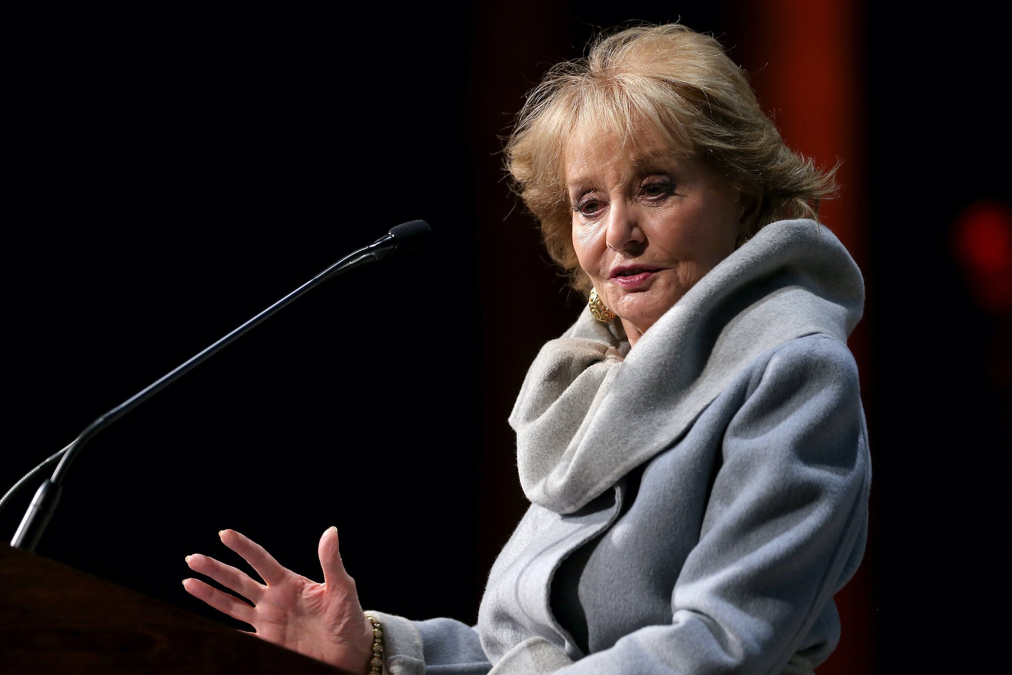 Barbara Walters at a microphone