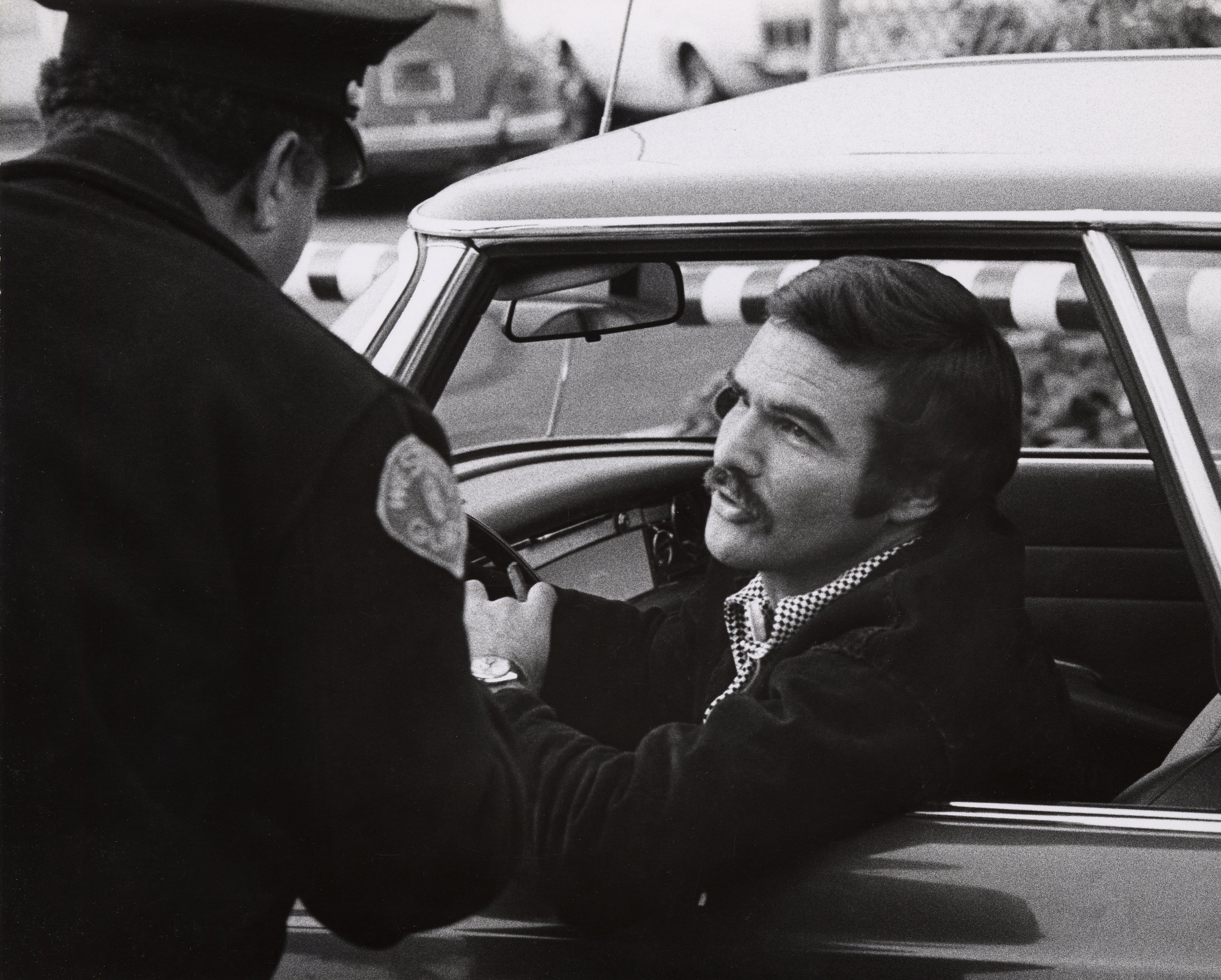 Burt Reynolds in a car