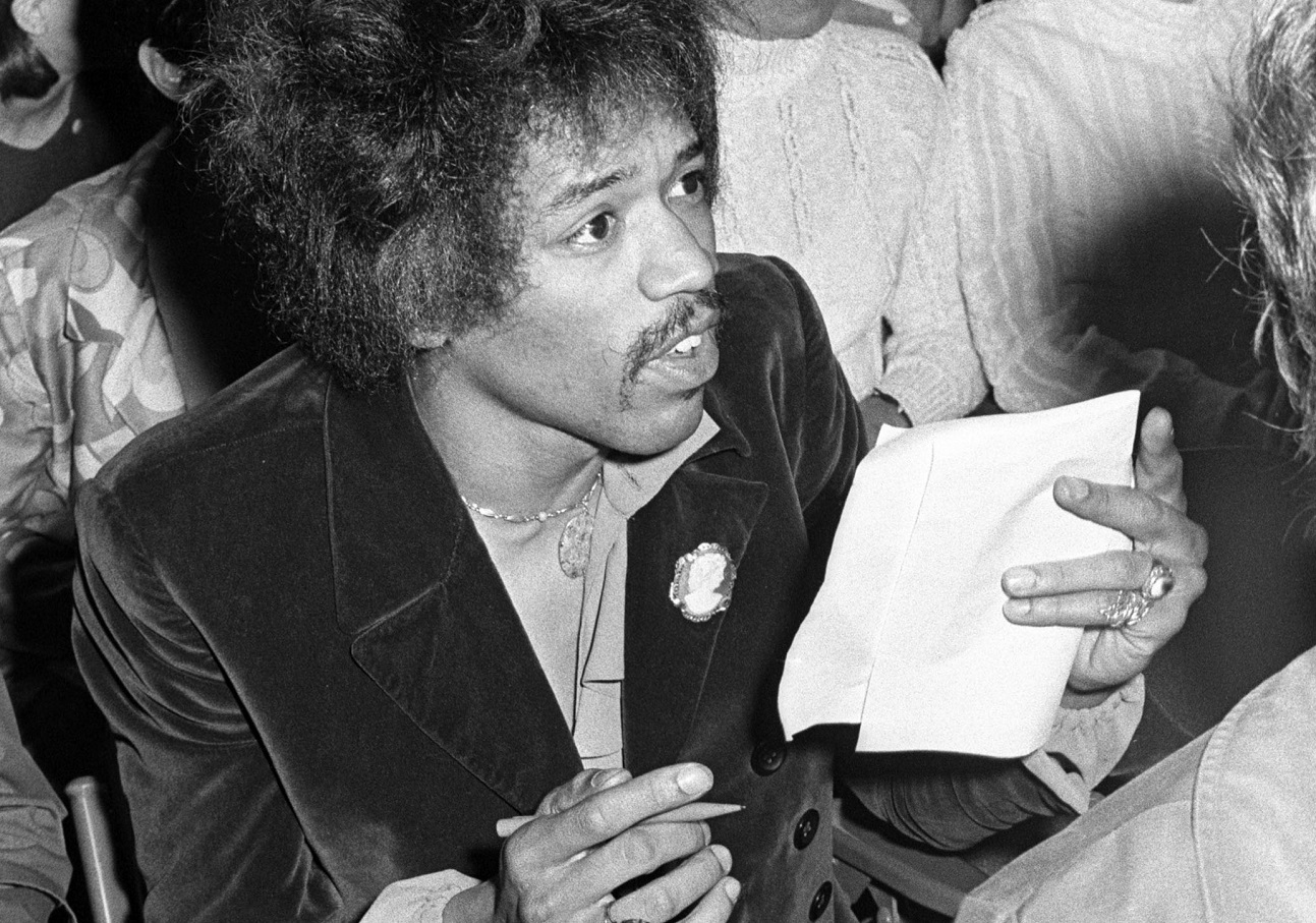 Hendrix holding a pencil and piece of paper