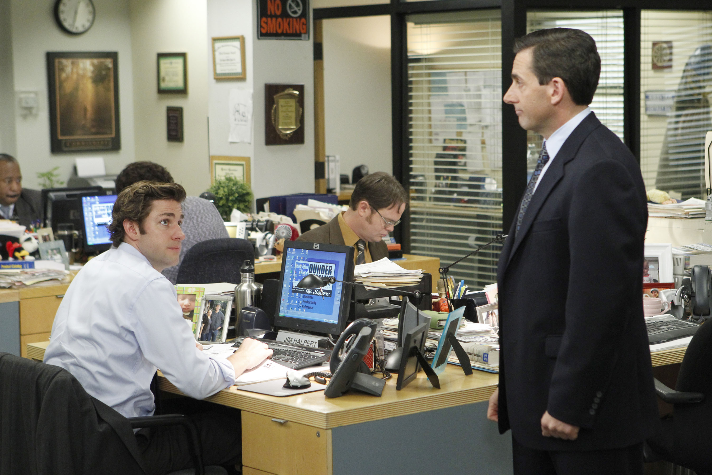 Jim Halpert and Michael Scott near a desk