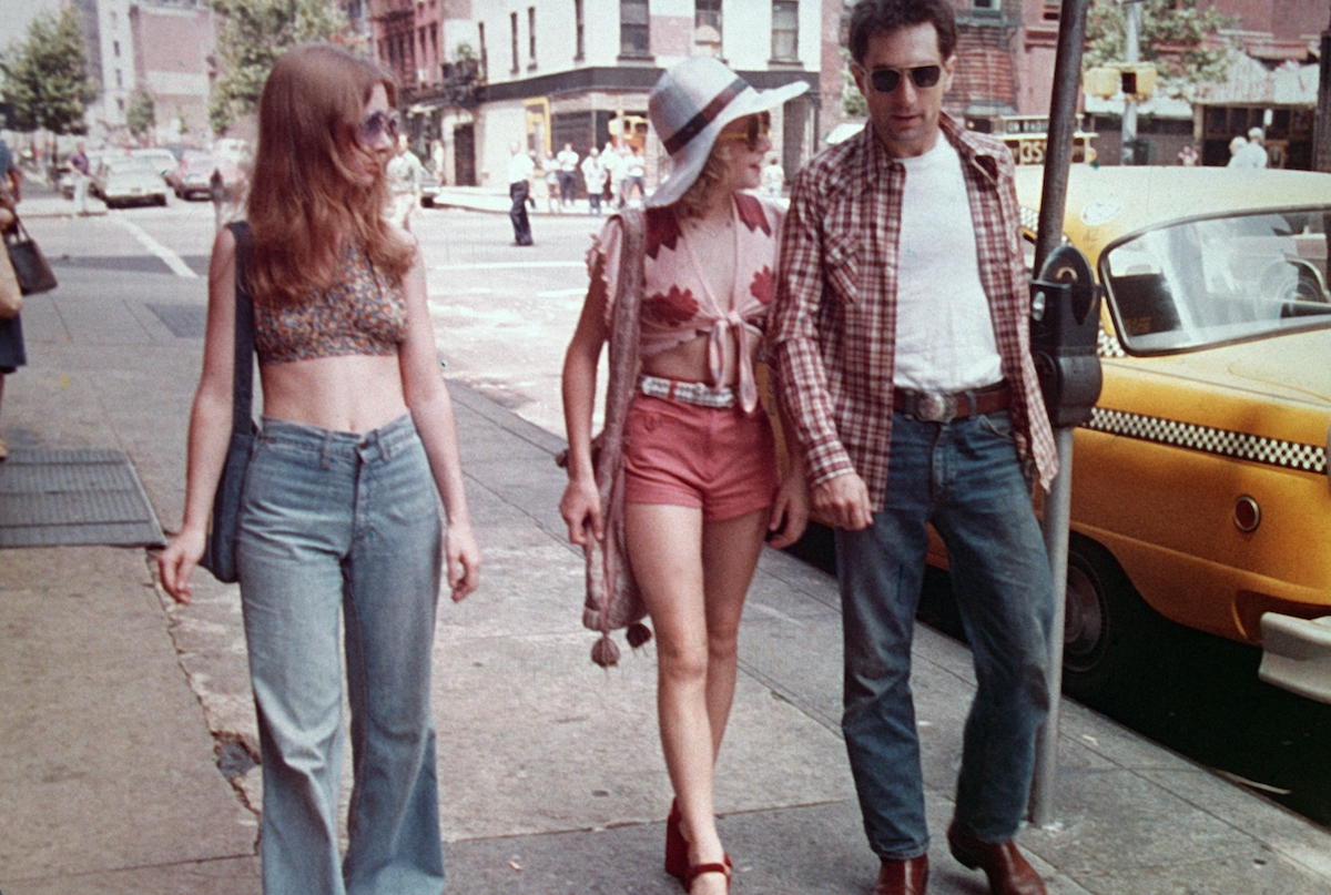 Jodie Foster and Robert De Niro walking on street in Taxi Driver