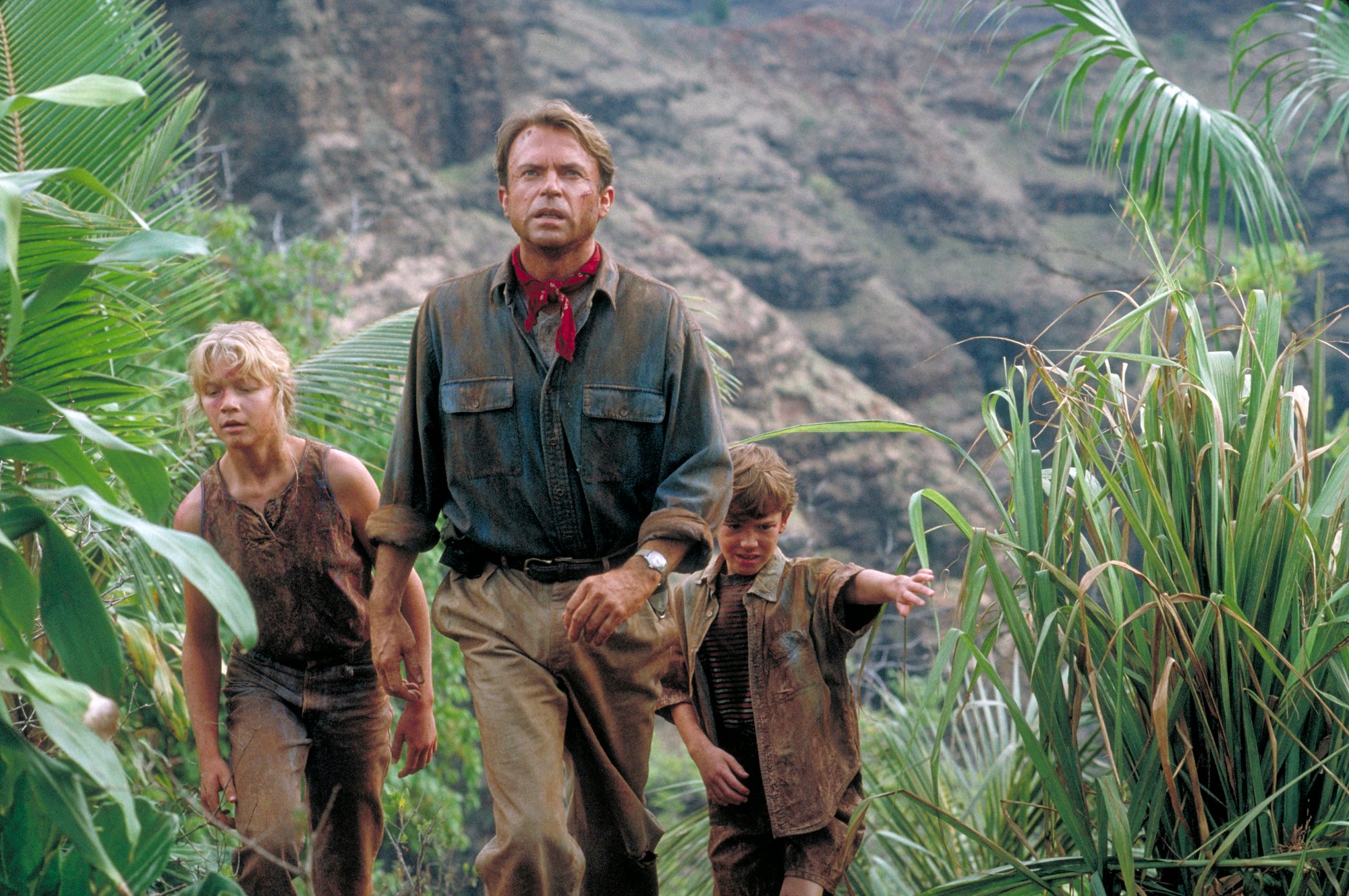 Sam Neill as Dr. Alan Grant, with Ariana Richards and Joseph Mazzello as Lex and Tim 