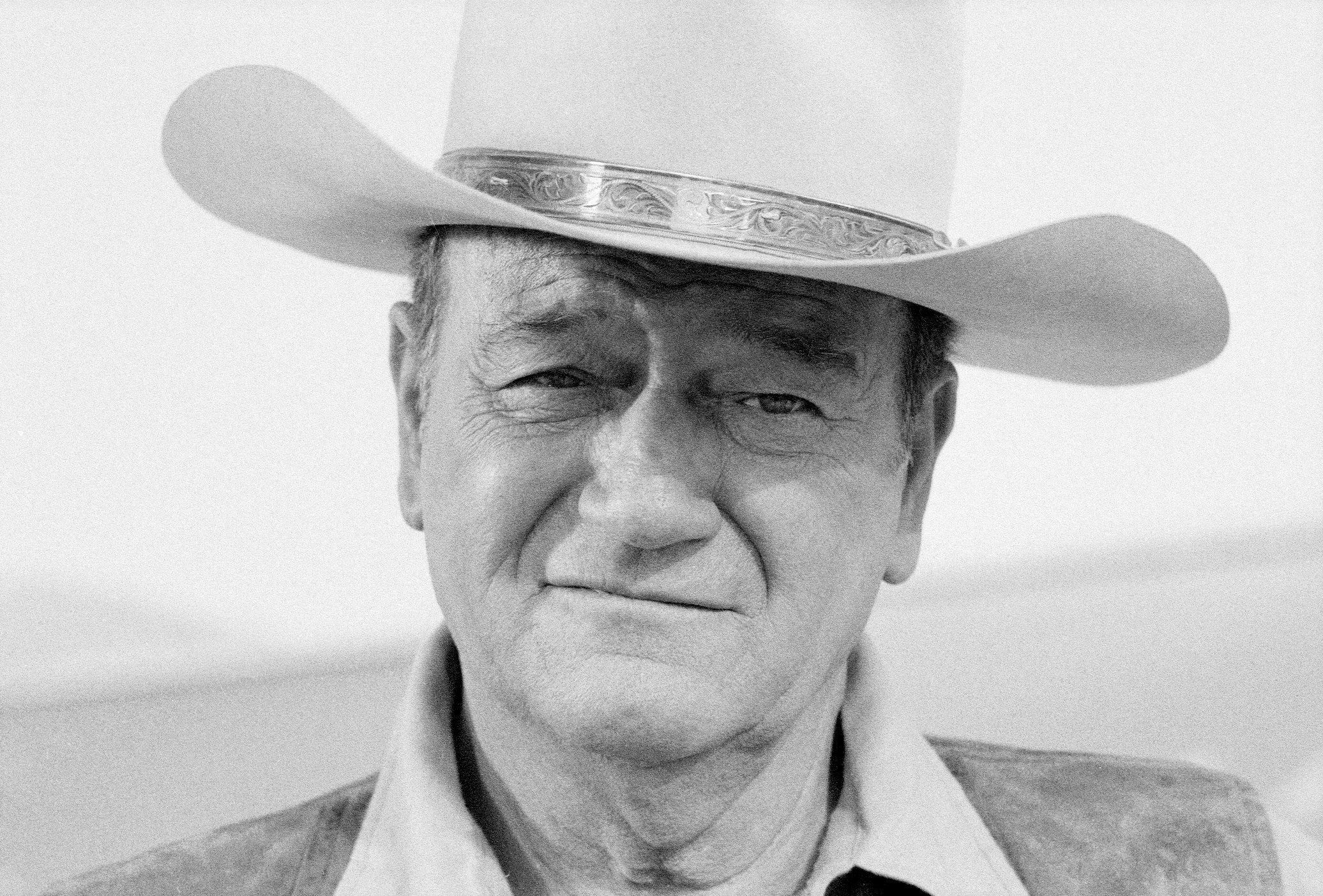 John Wayne wearing a cowboy hat
