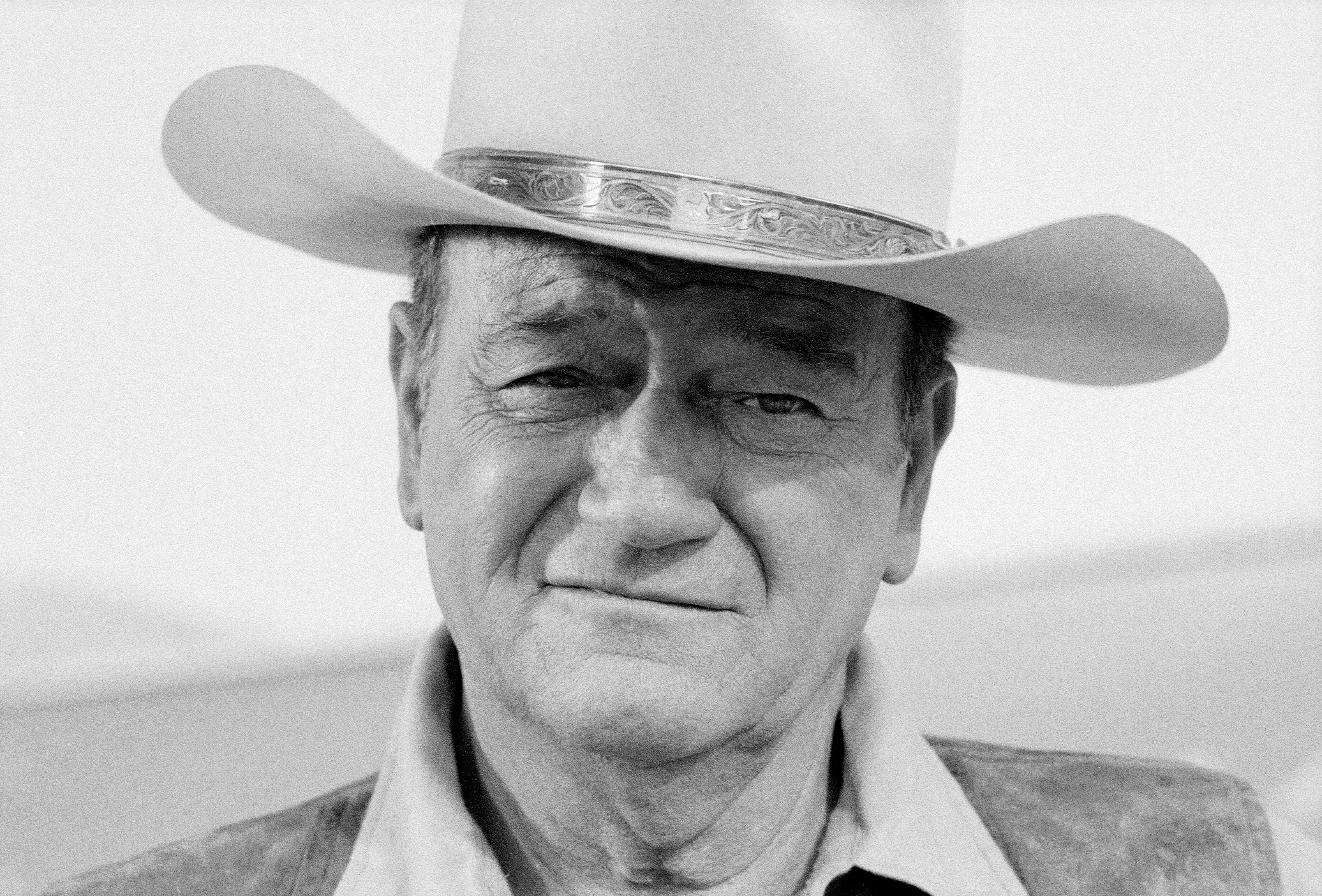 John Wayne wearing a cowboy hat