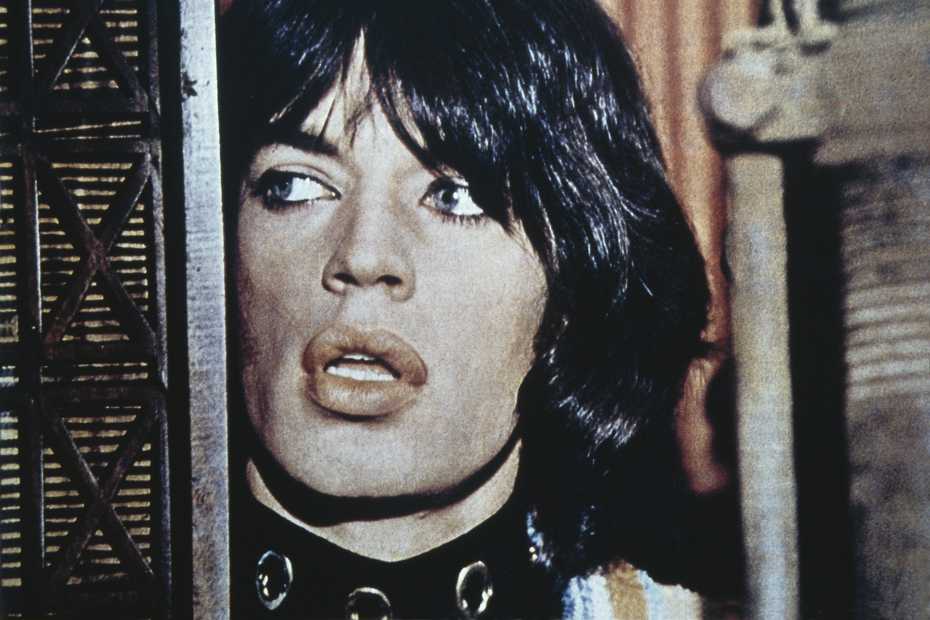 Mick Jagger wearing a necklace