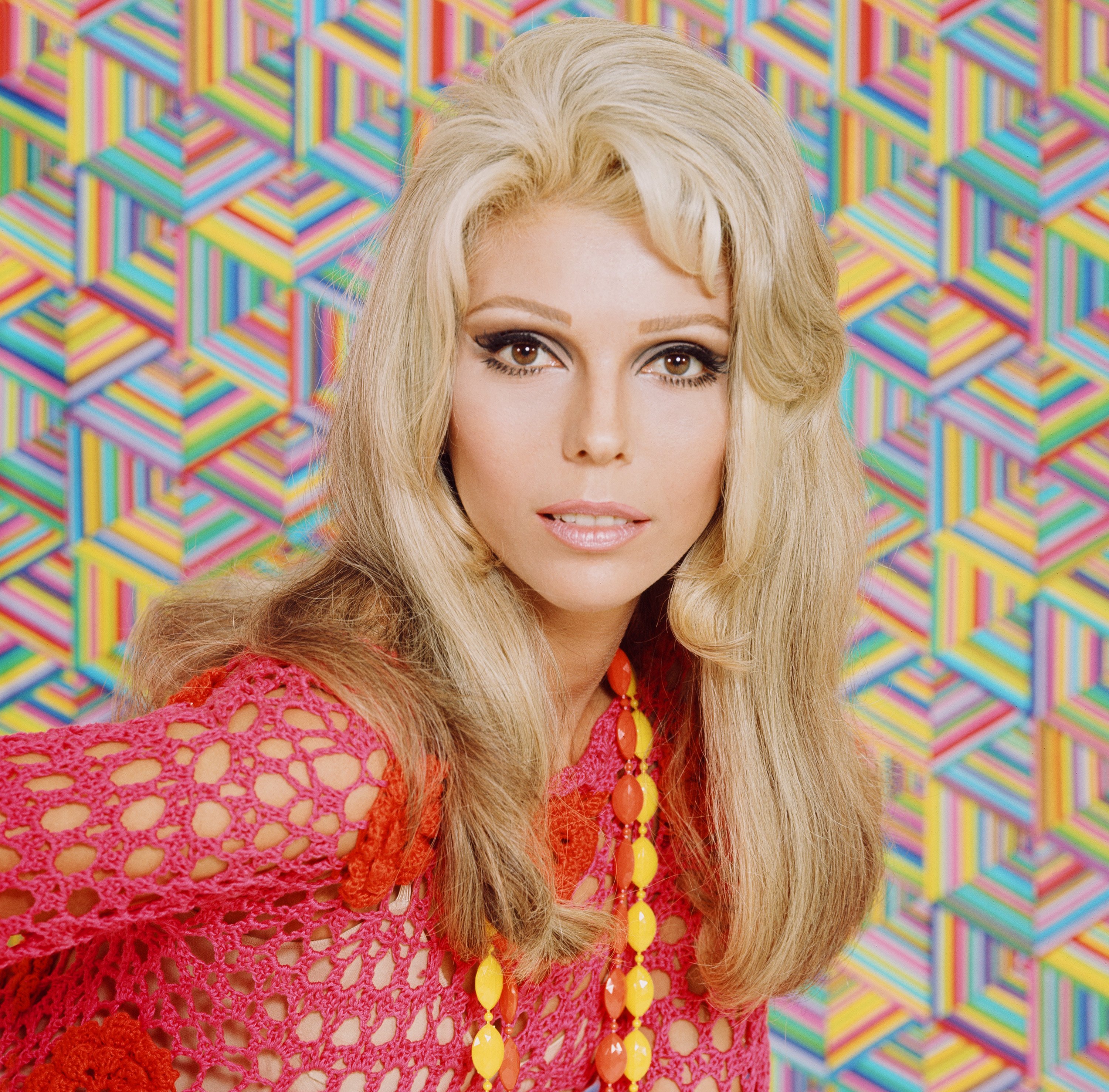 Nancy Sinatra wearing a yellow necklace