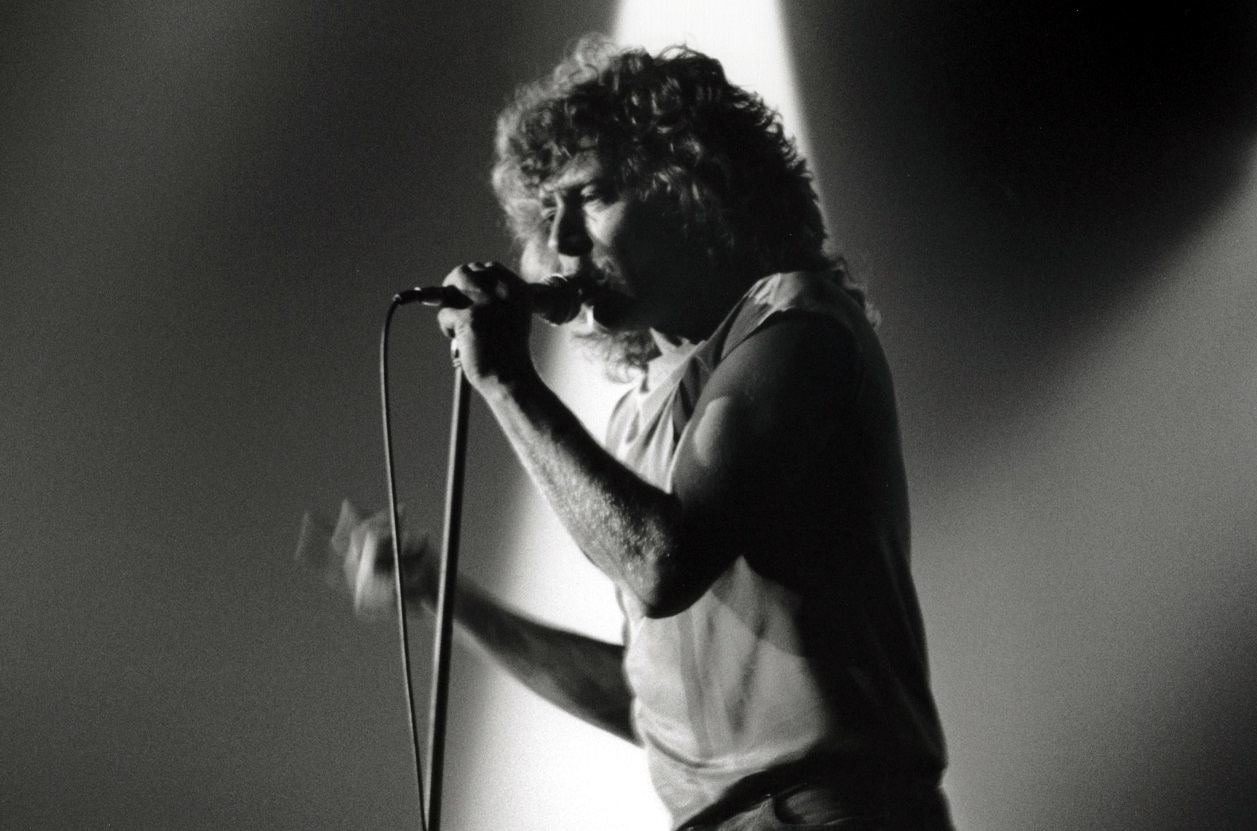 Robert Plant singing on stage in 1980